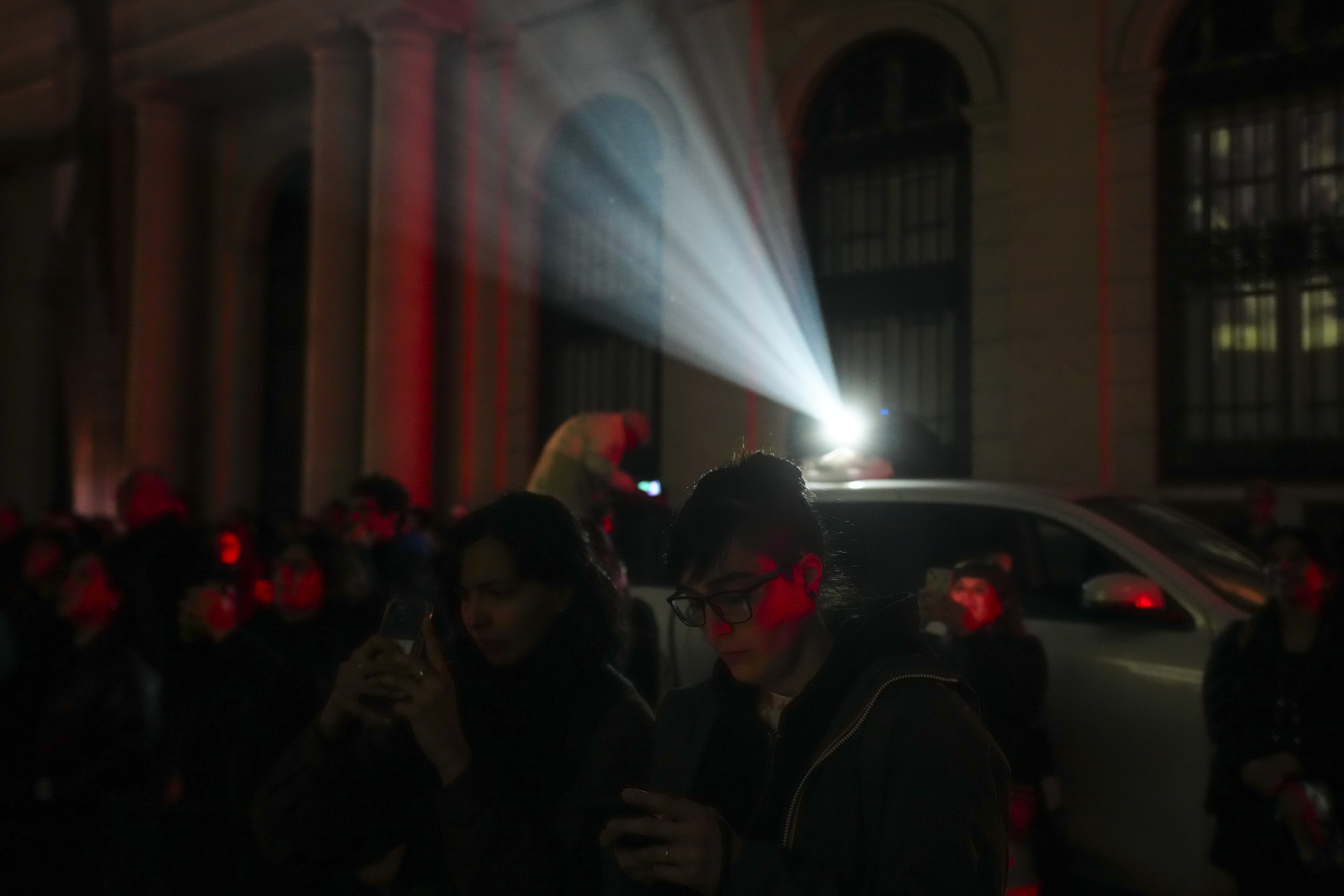 People attend an event honoring those disappeared during the regime of Gen. Augusto Pinochet, outside the Justice Palace in Santiago, Chile, Friday, Sept. 5, 2025. (Esteban Felix - AP)