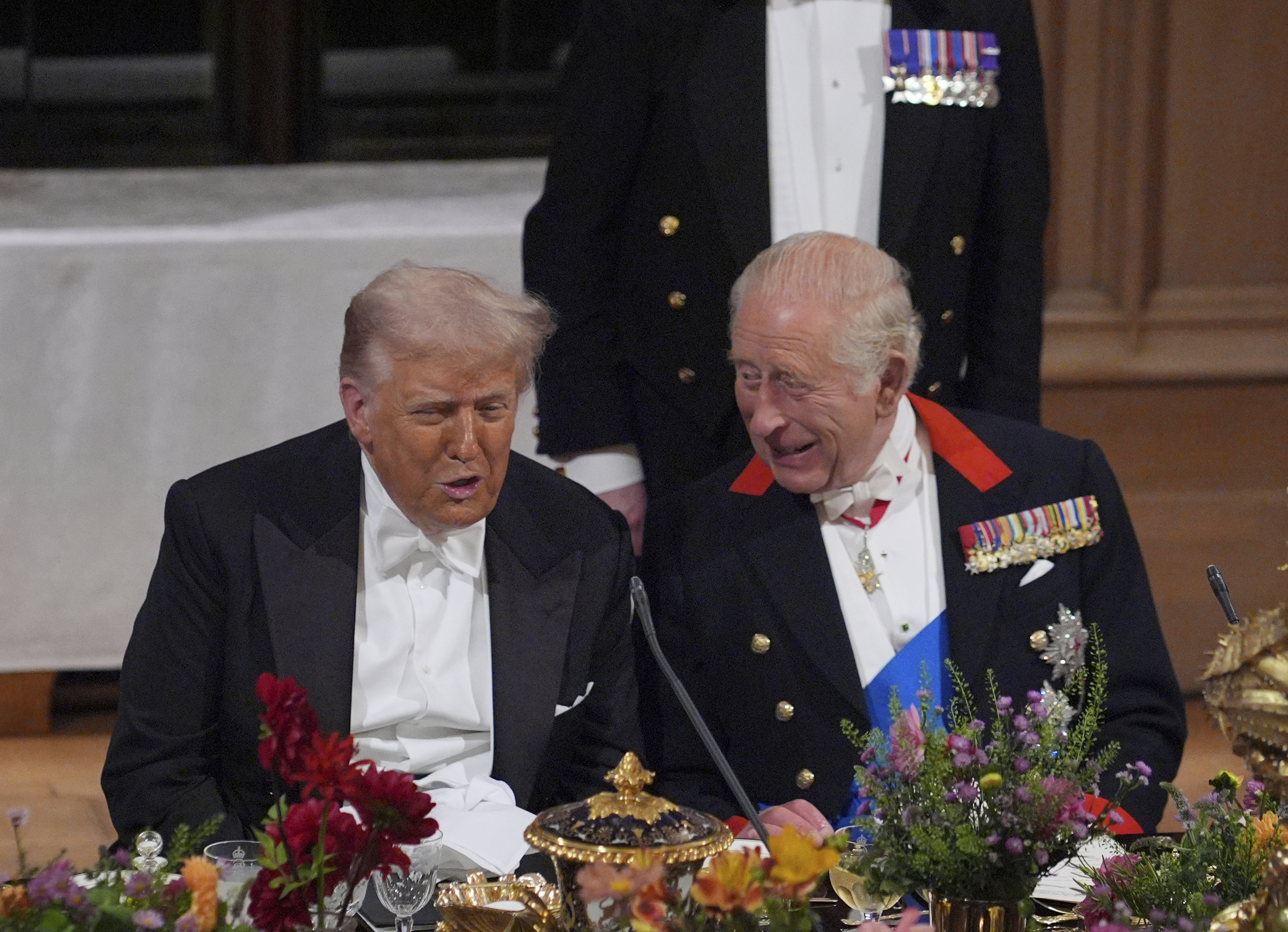 U.S. President Donald Trump, left, and Britain's King Charles speak during the State Banquet in Windsor Castle, England, on day one of U.S. President Donald Trump and First Lady Melania Trump's second state visit to the UK, Wednesday Sept. 17, 2025. (Yui Mok - Pool PA)