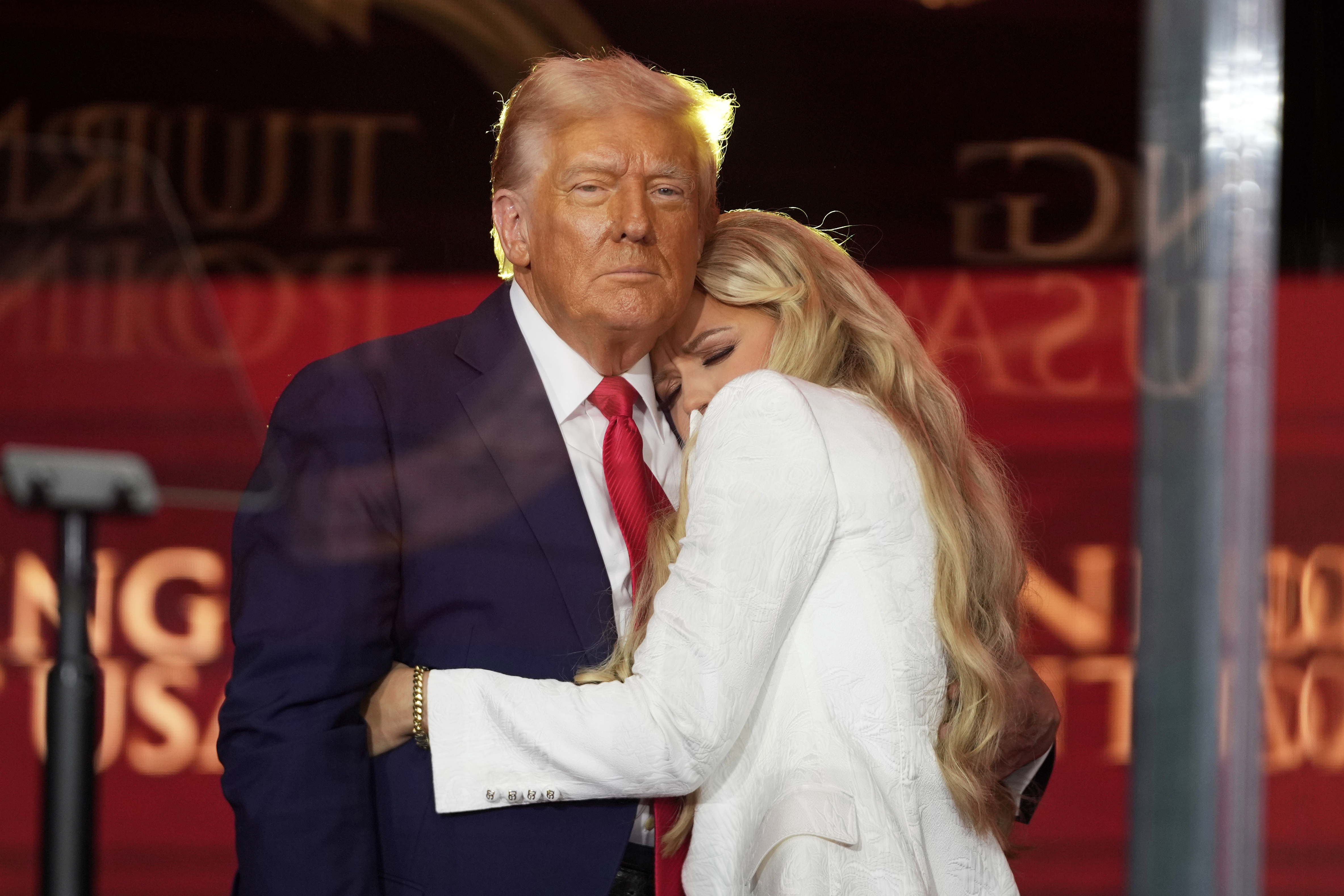 President Donald Trump, left, hugs Erika Kirk at the memorial of her husband, conservative activist Charlie Kirk, Sunday, Sept. 21, 2025, at State Farm Stadium in Glendale, Ariz. (Julia Demaree Nikhinson - AP)