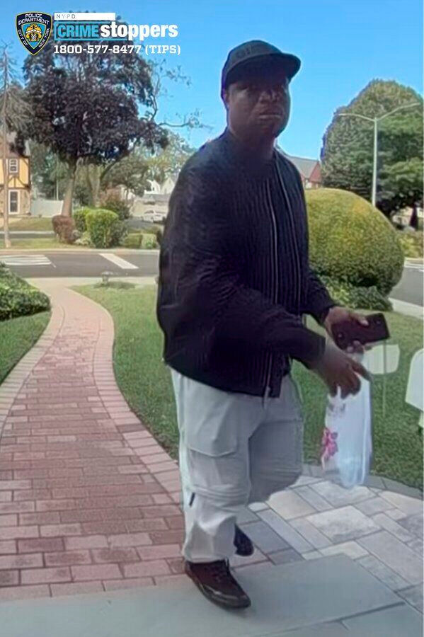 New York City police hunt for man suspected of killing elderly couple and burning their home