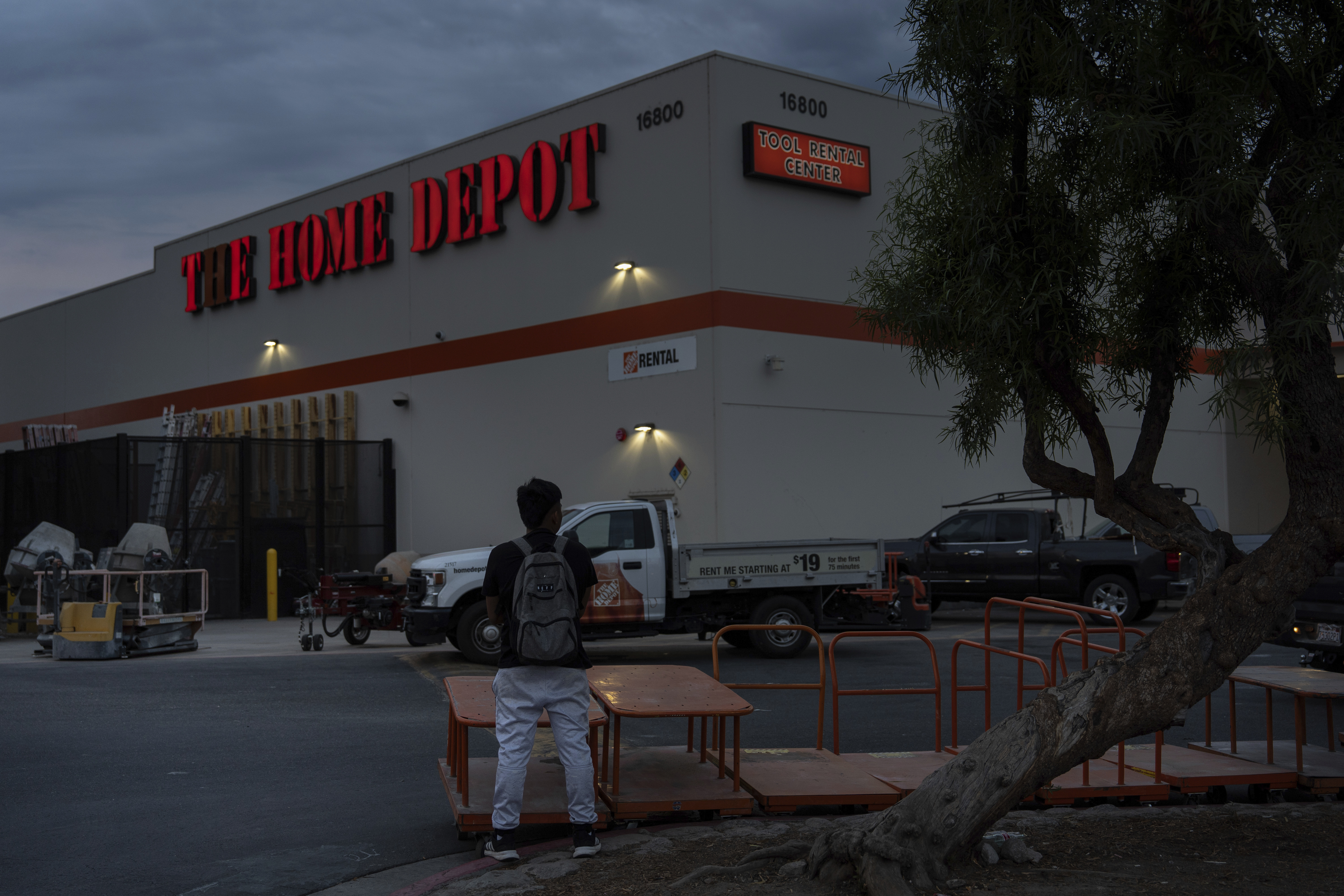 A day laborer waits for work in the parking lot of a Home Depot in the Van Nuys section of Los Angeles, TAug. 28, 2025. (Jae C. Hong - AP)