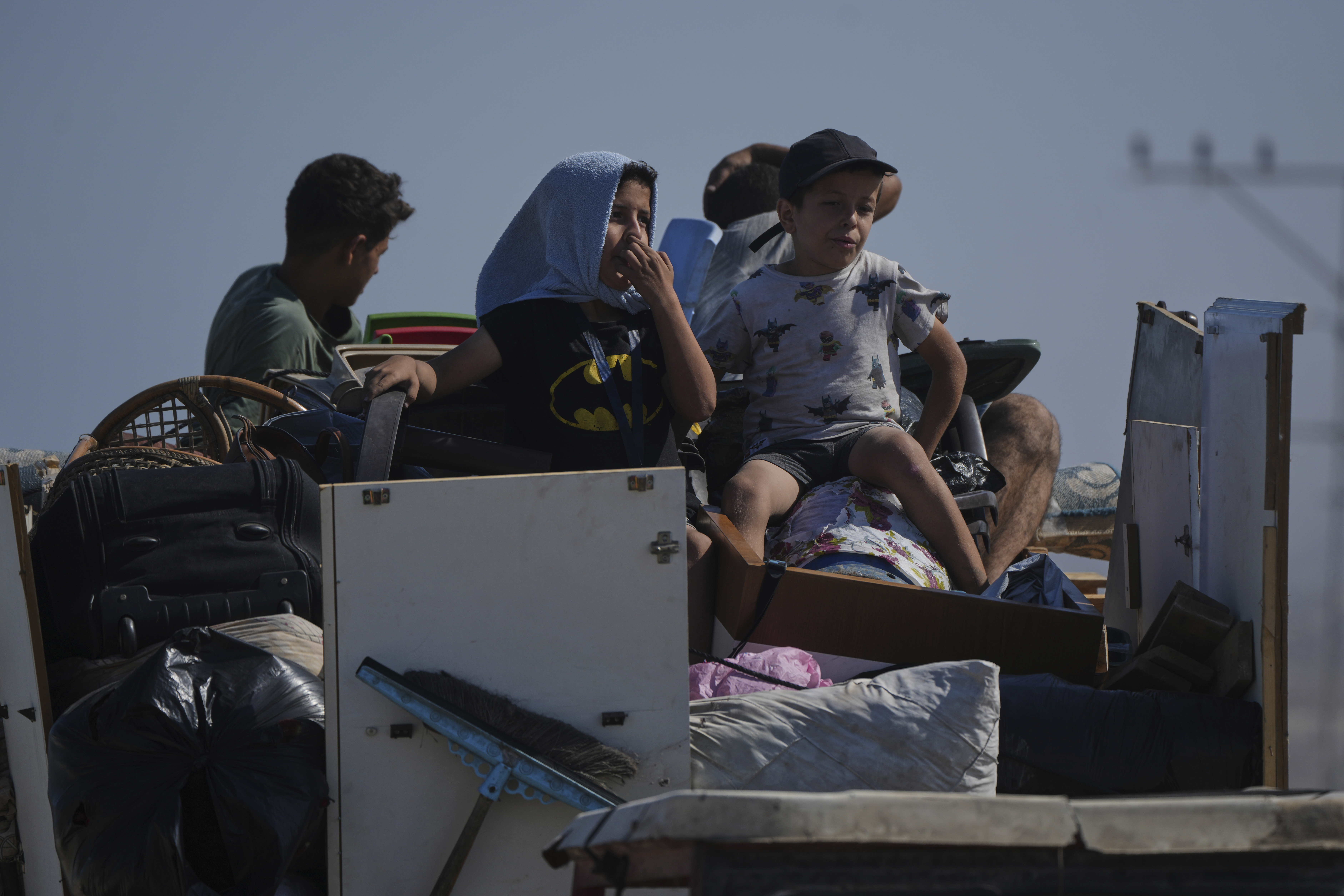 Displaced Palestinians fleeing northern Gaza carry their belongings along the coastal road toward southern Gaza, Tuesday, Sept. 9, 2025, after the Israeli army issued evacuation orders from Gaza City. (Jehad Alshrafi - AP)