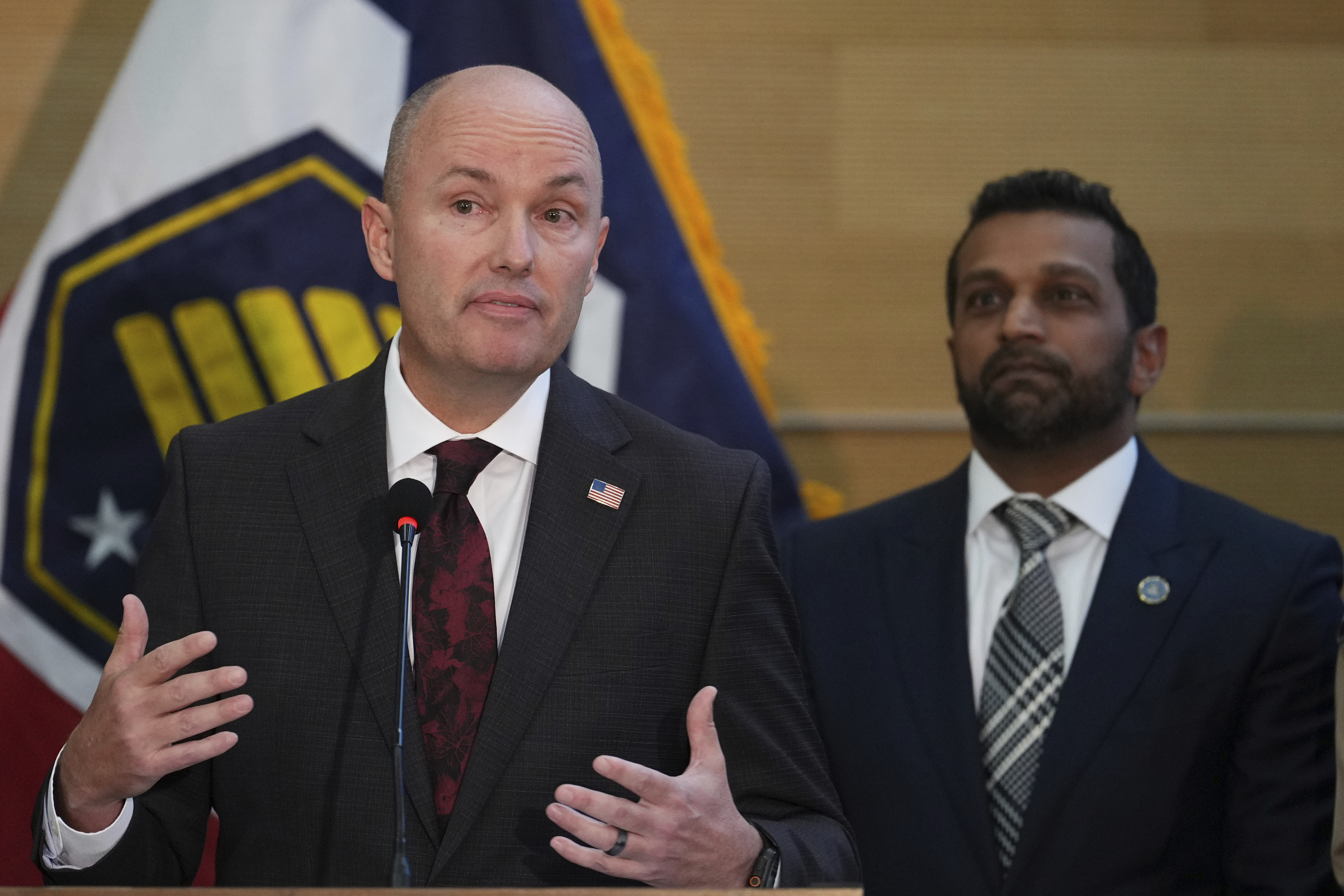 Utah Gov. Spencer Cox speaks at a news conference, as FBI Director Kash Patel looks on, Friday, Sept. 12, 2025, in Orem, Utah, (Lindsey Wasson - AP)