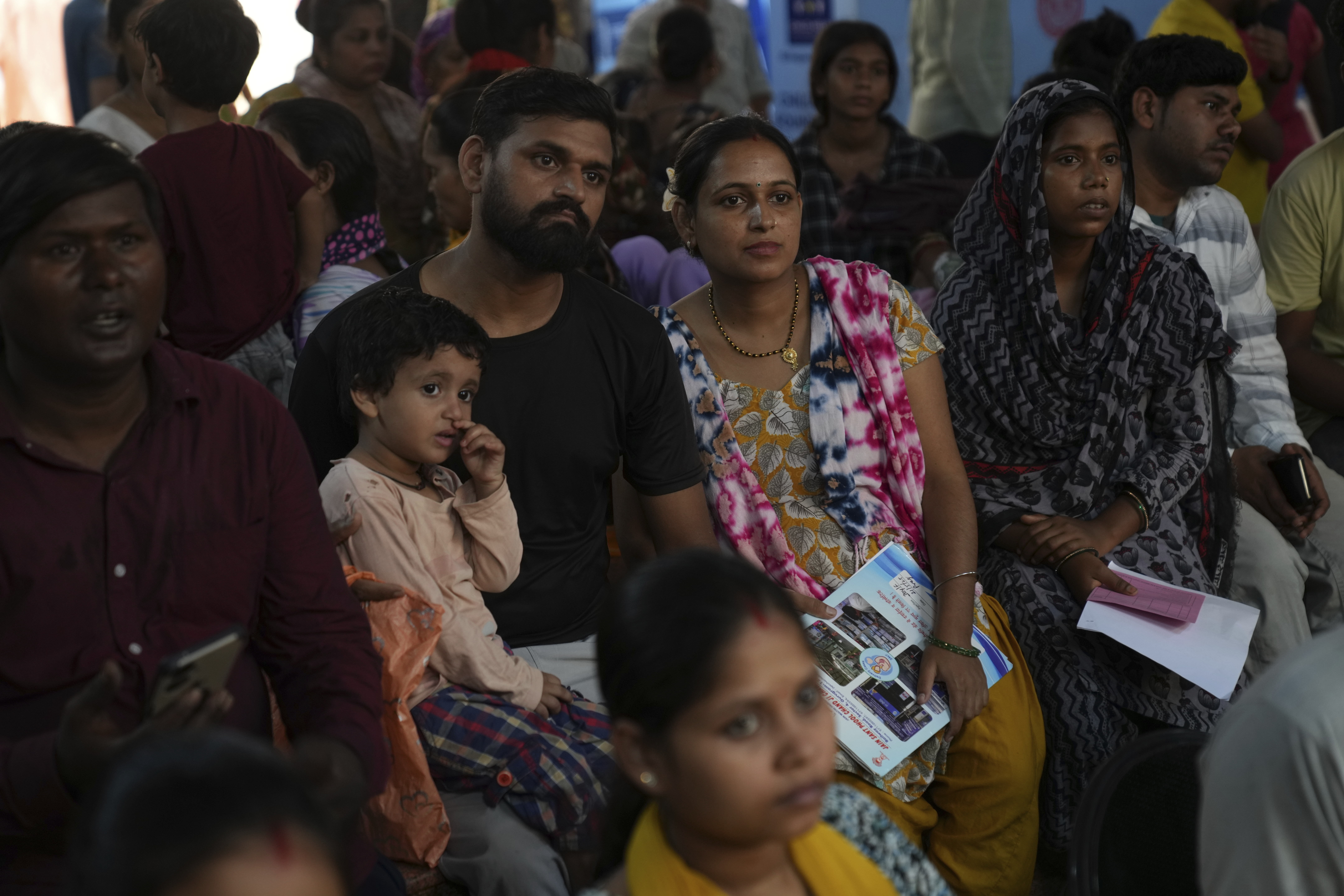 Rajkumar Varma, center, left, and his pregnant wife Anju Varma participats in an antenatal Care Companion Program (CCP) at a government hospital in Gurugram, a satellite city of New Delhi, India, on Aug. 7, 2025. (Manish Swarup - AP)
