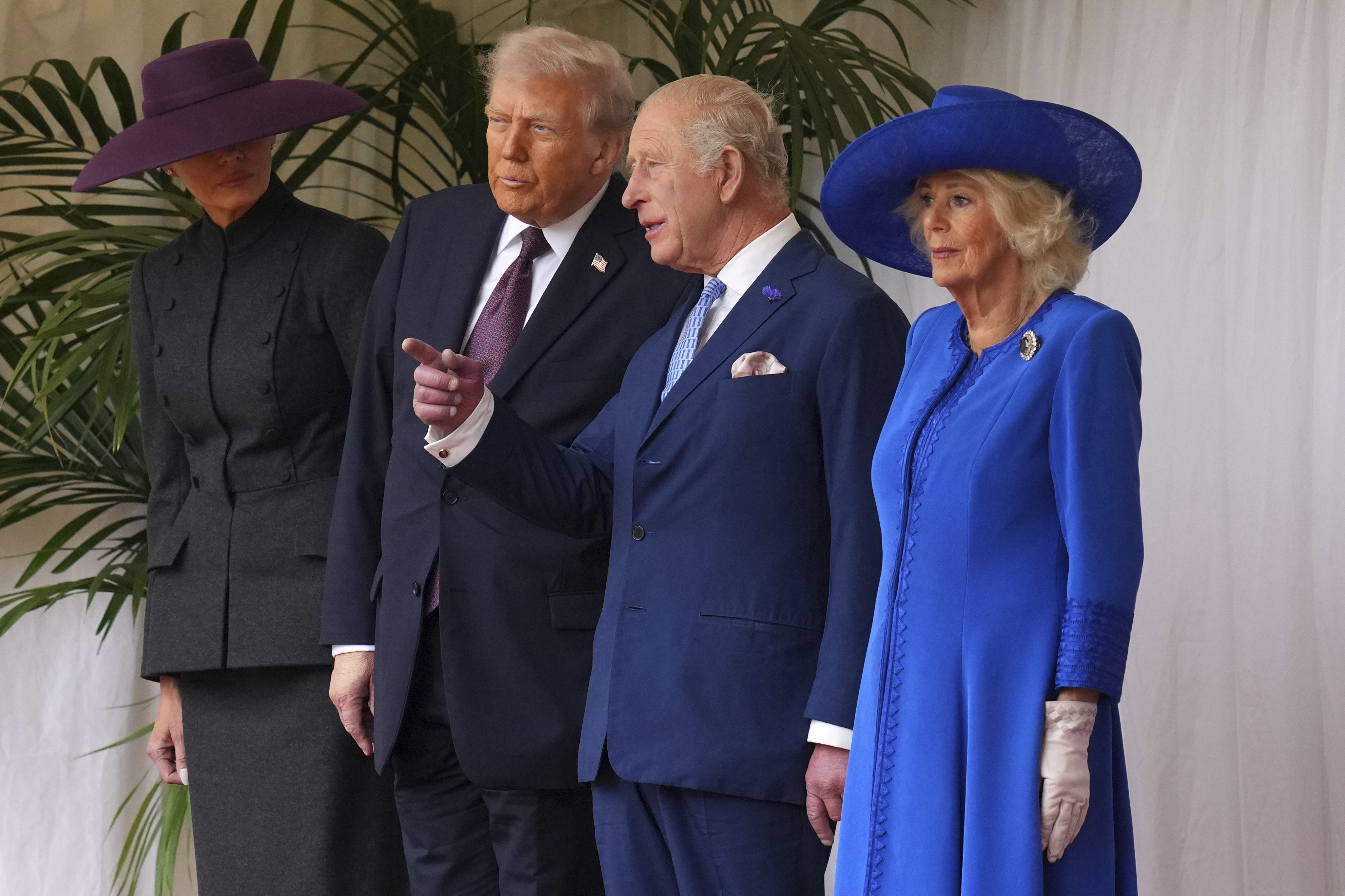 President Donald Trump, Britain's King Charles III, Queen Camilla and Melania Trump on the left wait to review the Guard of Honour at Windsor Castle in Windsor, England, Wednesday, Sept. 17, 2025. (Kirsty Wigglesworth - Pool AP)