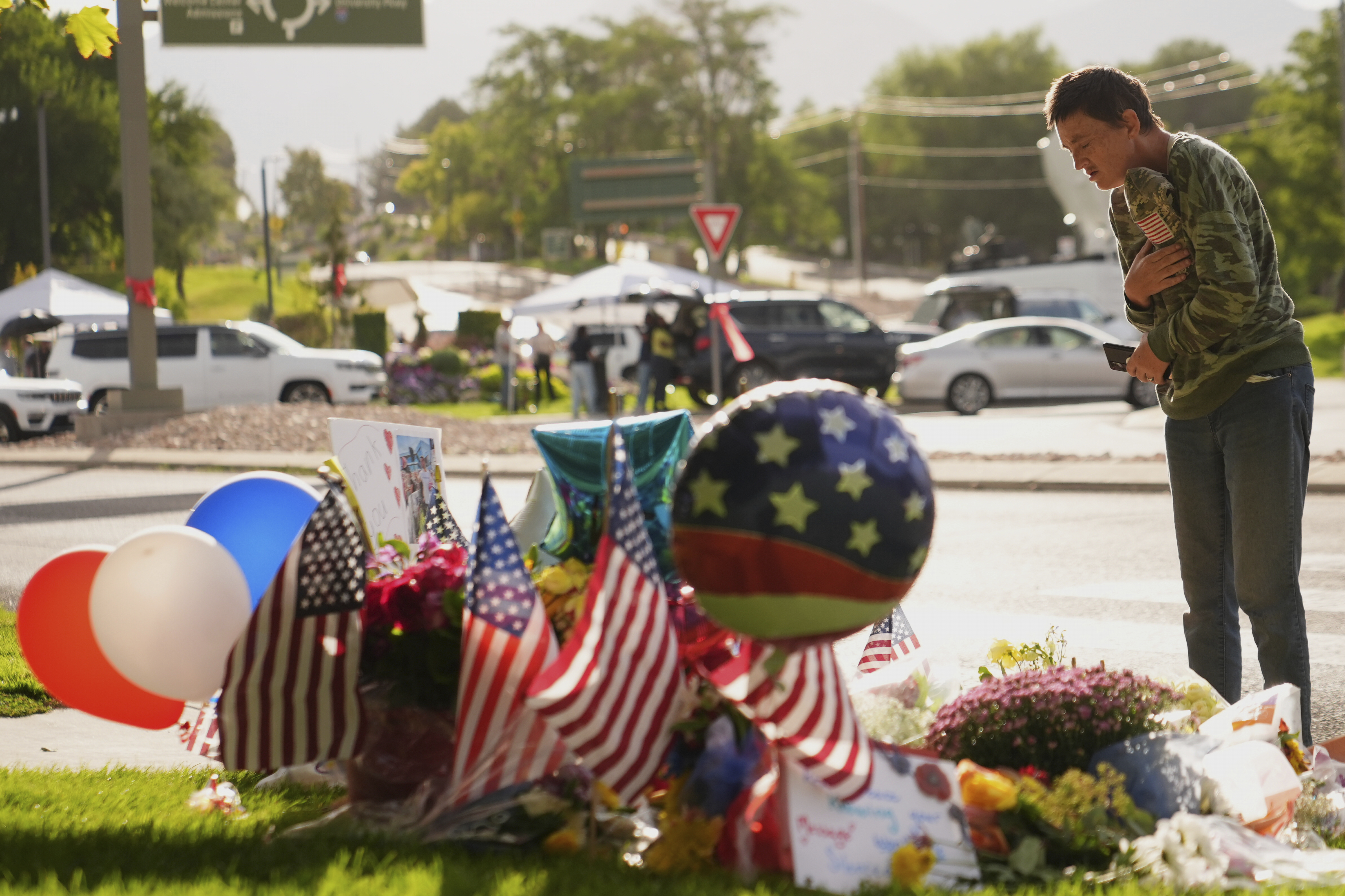 Wendy Lucas, a Utah Valley University student, looks at a memorial set up for Charlie Kirk at Utah Valley University in Orem, Utah, Friday, Sept. 12, 2025. (Lindsey Wasson - AP)
