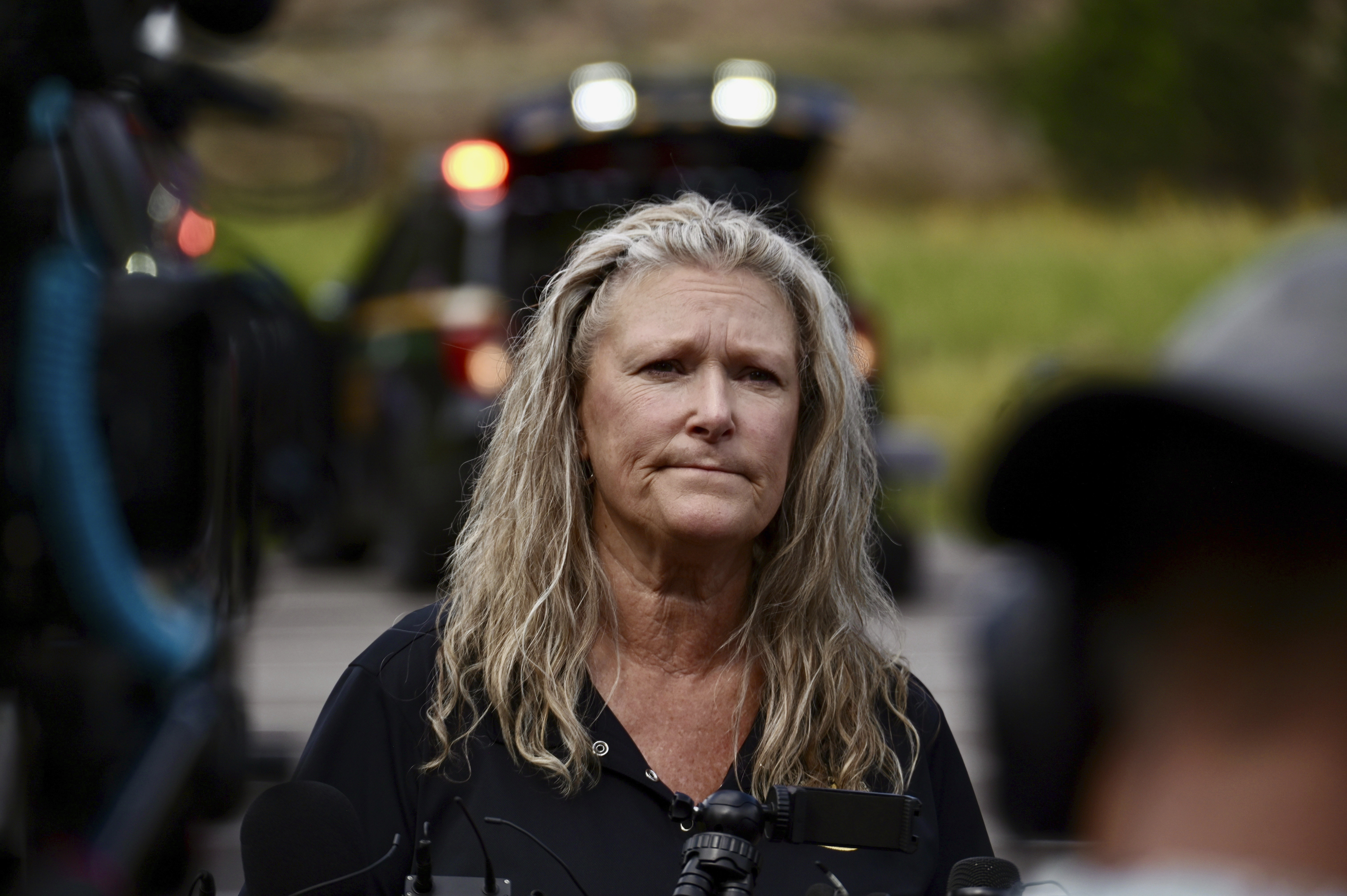 Jefferson County, Colo., Sheriffs Department spokesperson Jacki Kelley waits to speak with members of the media after a shooting at Evergreen High School Wednesday, Sept. 10, 2025, in Evergreen,Colo. (Hyoung Chang - The Denver Post)