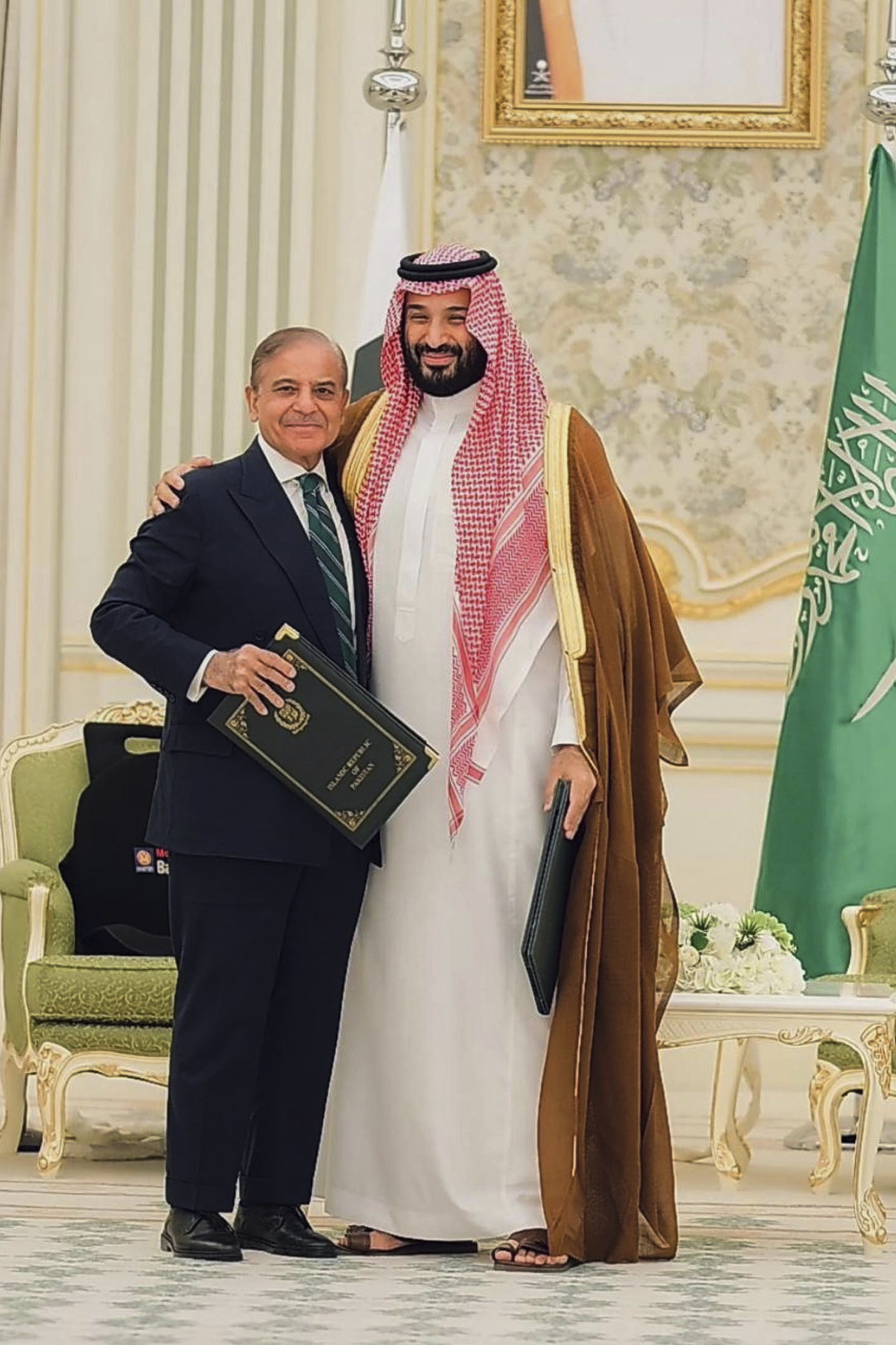 In this photo released by Pakistan's Press Information Department, Saudi Arabia's Crown Prince Mohammed bin Salman, right, and Pakistan's Prime Minister Shehbaz Sharif pose for photograph after signing a mutual defense pact, in Riyadh, Saudi Arabia, Wednesday, Sept. 17, 2025. (Uncredited - Press Information Department)