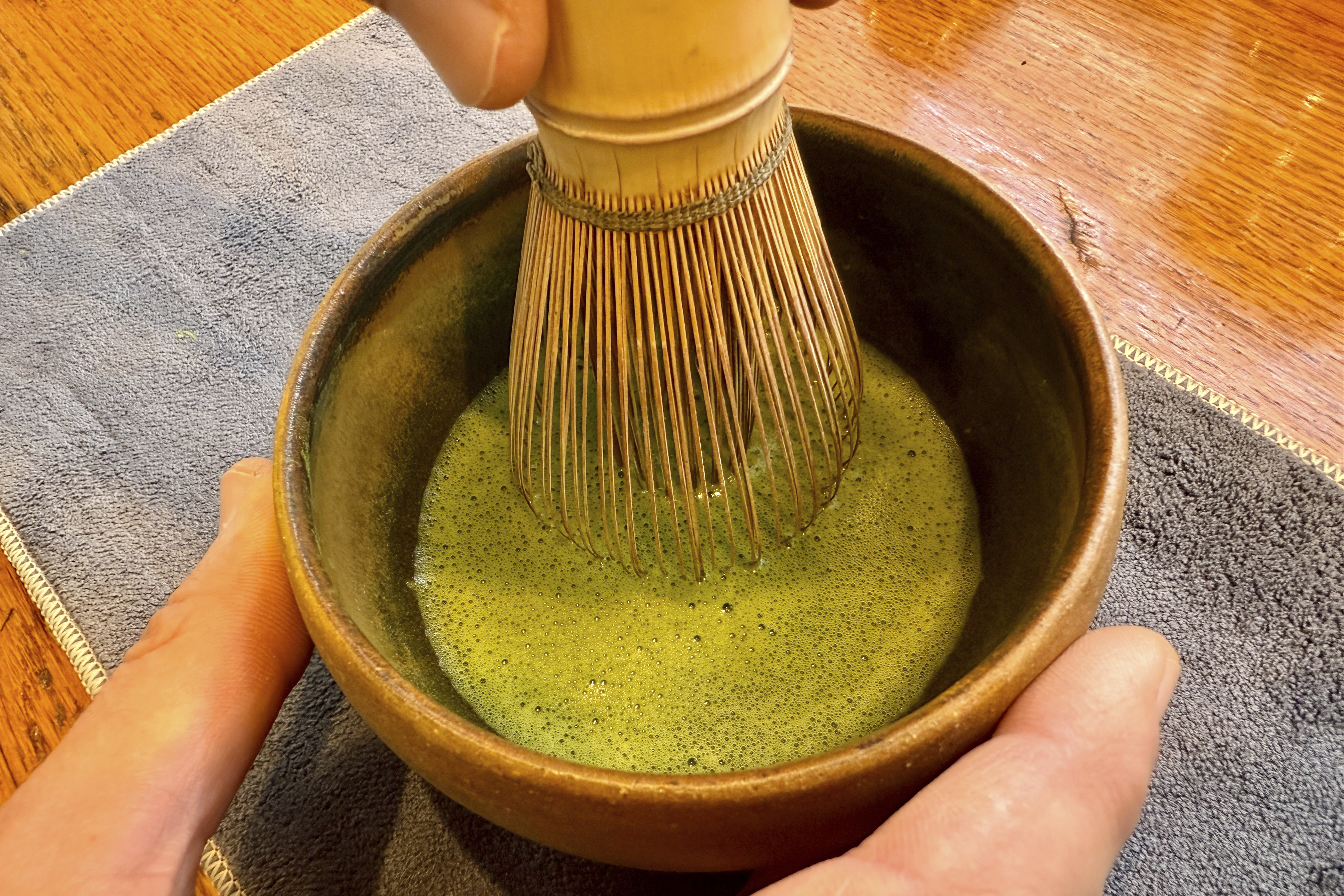Senior Tea Buyer Aaron Vick uses a whisk to make a matcha drink inside The G.S. Haly Company's tea tasting room in Redwood City, Calif., Wednesday, Sept. 10, 2025. (Haven Daley - AP)