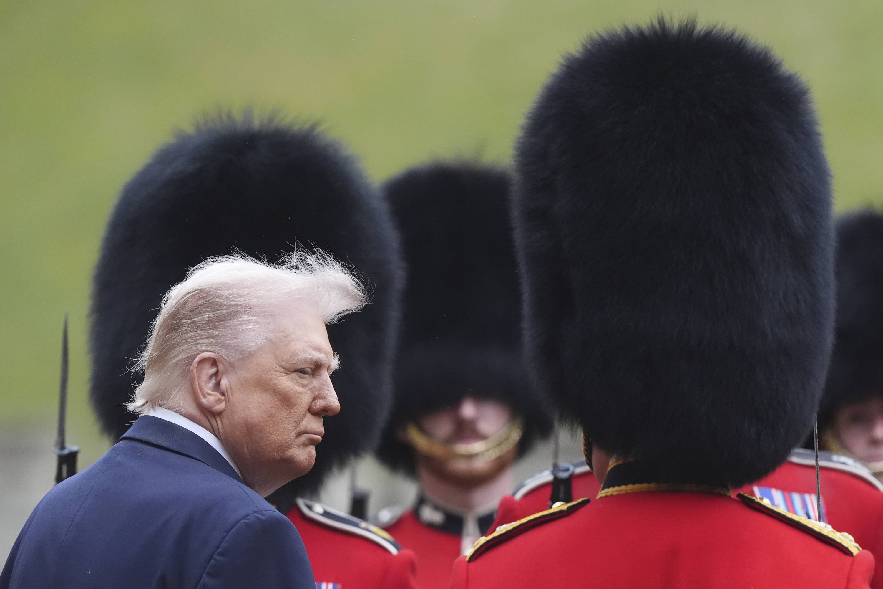 President Donald Trump reviews the guard of honour with Britain's King Charles III during the ceremonial welcome at Windsor Castle, England, Wednesday, Sept. 17, 2025. (Jonathan Brady - Pool PA)