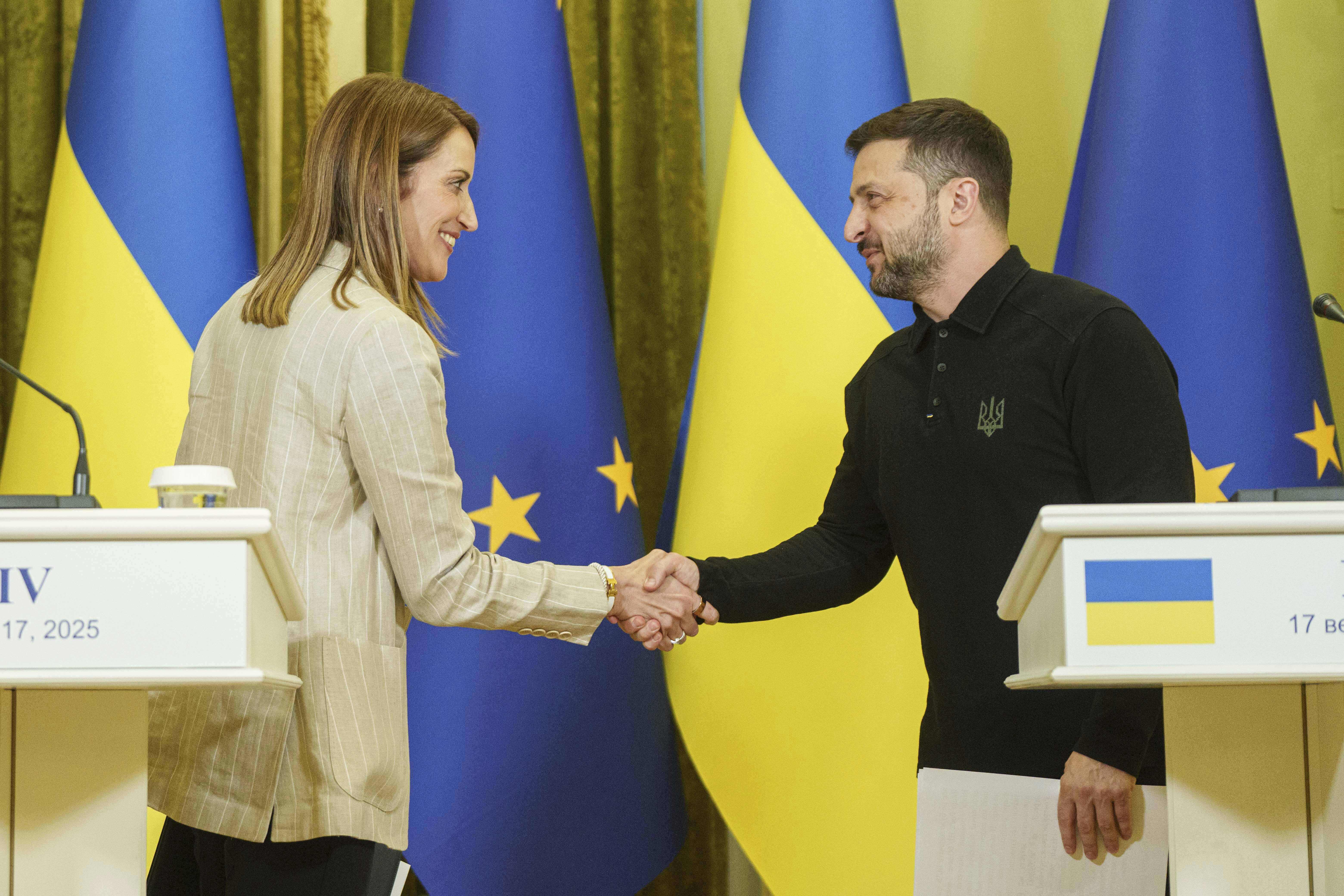 European Parliament President Roberta Metsola and Ukraine's President Volodymyr Zelenskyy shake hands after a joint press conference in Kyiv, Ukraine, Wednesday, Sept. 17, 2025. (Evgeniy Maloletka - AP)