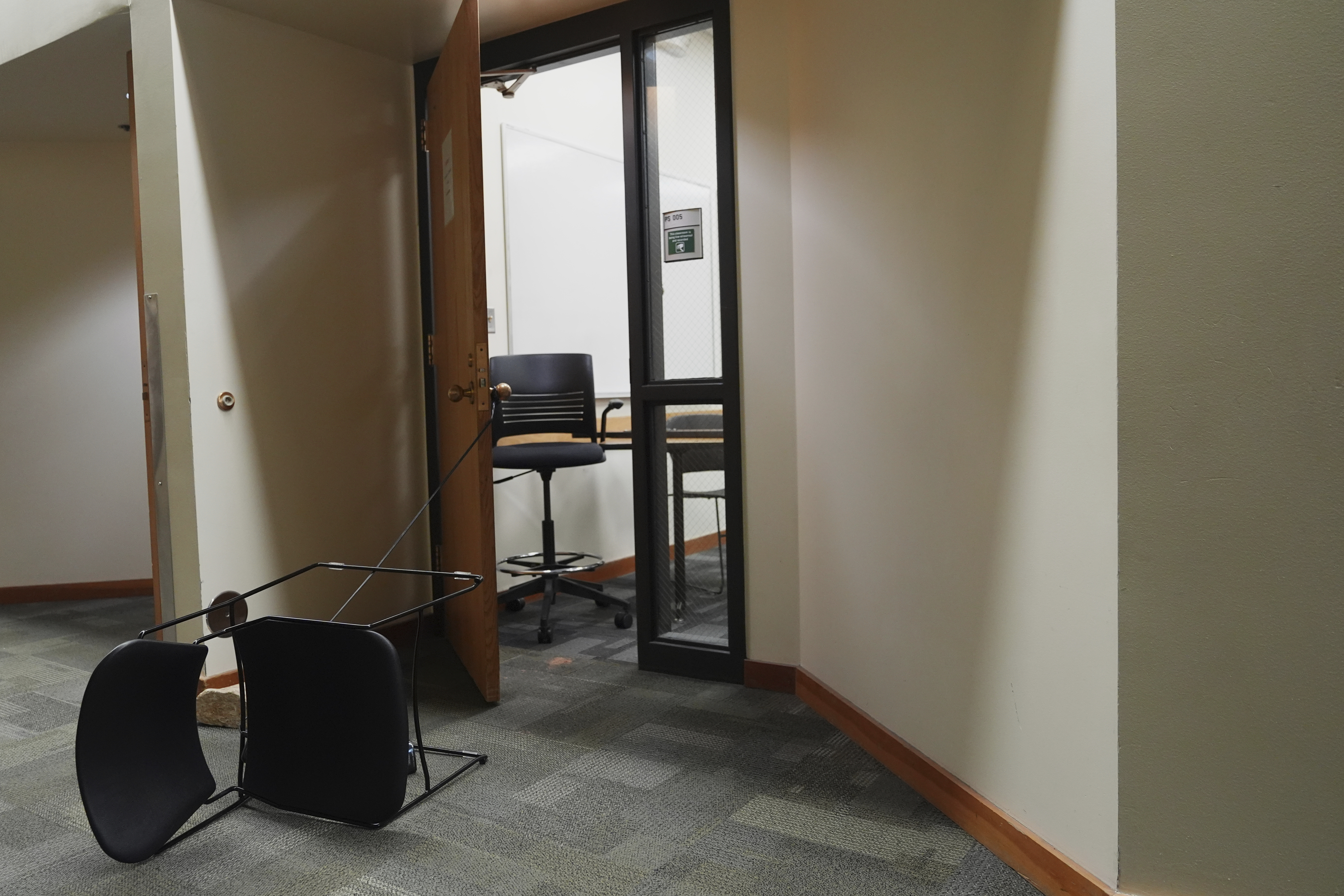 A chair is tied to a door from a classroom a day after the shooting of Charlie Kirk at Utah Valley University in Orem, Utah, Thursday, Sept. 11, 2025. (Lindsey Wasson - AP)