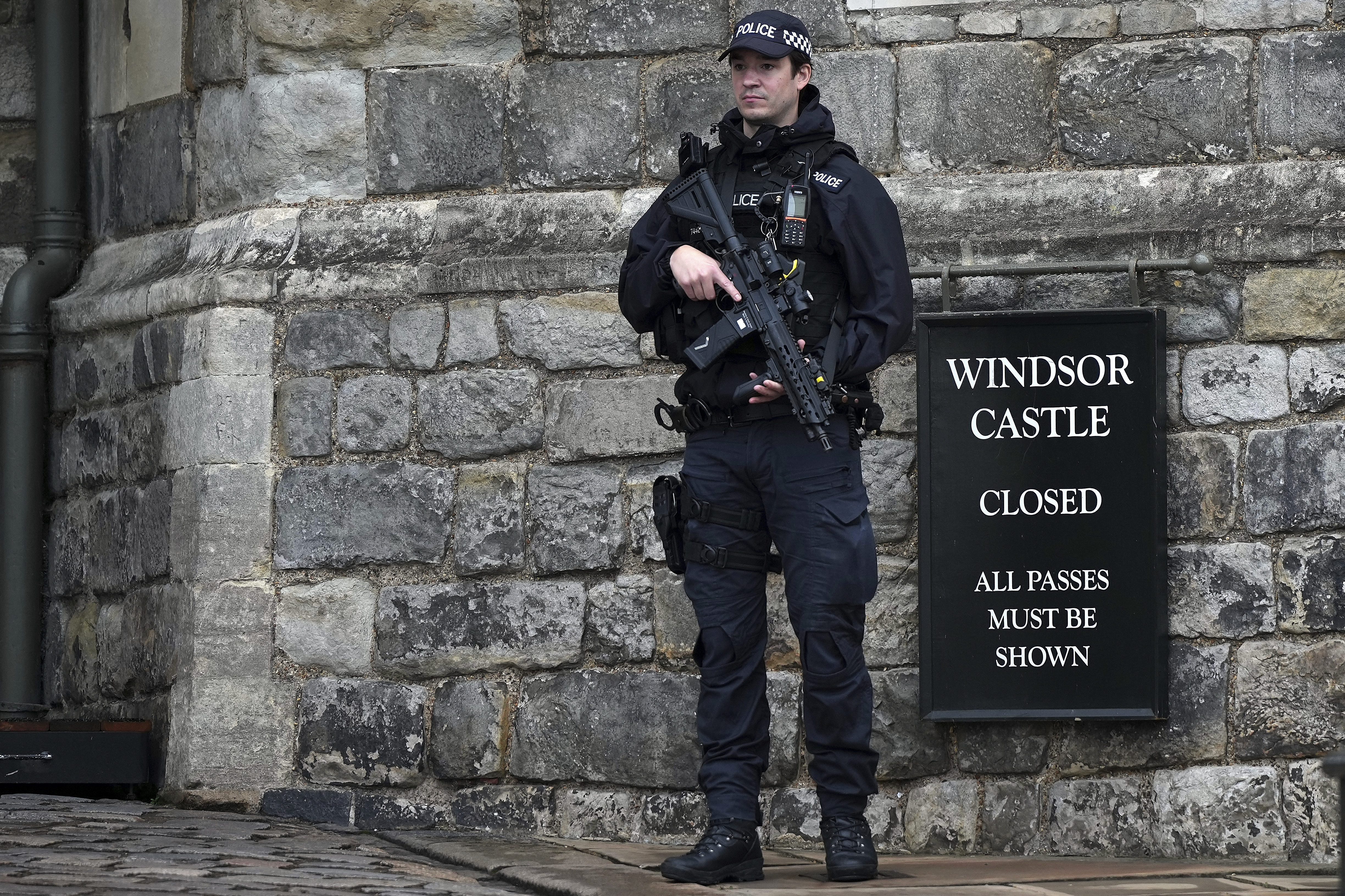 An armed police officer stands guard at the entrance to Windsor Castle ahead of the arrival of President Donald Trump in Windsor, England, Wednesday, Sept. 17, 2025. (Alastair Grant - AP)