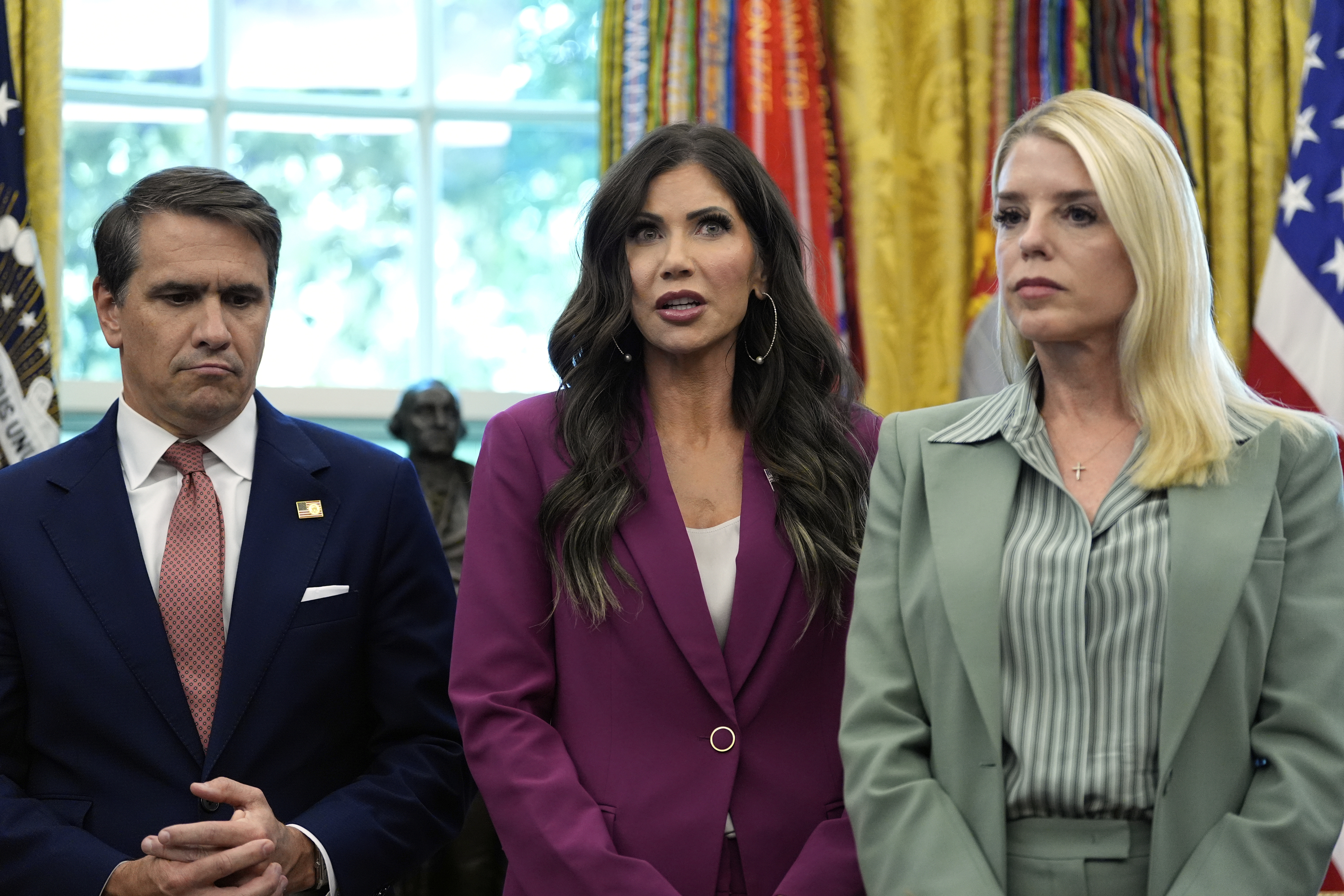 Homeland Security Secretary Kristi Noem, center, speaks as Deputy Attorney General Todd Blanche, left, and Attorney General Pam Bondi, right, listen during an event with President Donald Trump in the Oval Office of the White House, Monday, Sept. 15, 2025, in Washington. (Alex Brandon - AP)