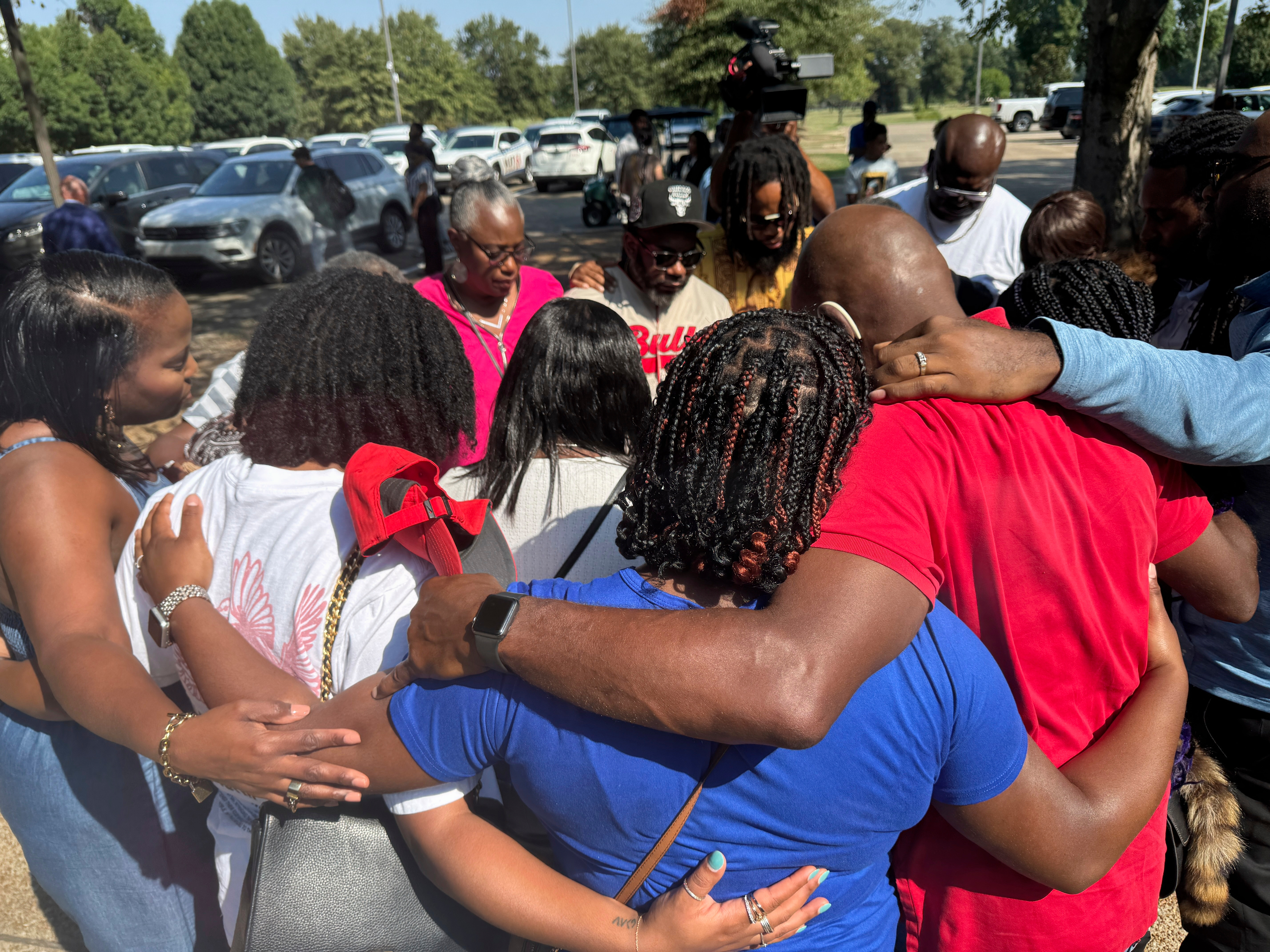 Friends and family of a deceased Delta State University student gather outside to pray after a law enforcement briefing, Wednesday, Sept. 17, 2025, in Cleveland, Miss. (Sophie Bates - AP)