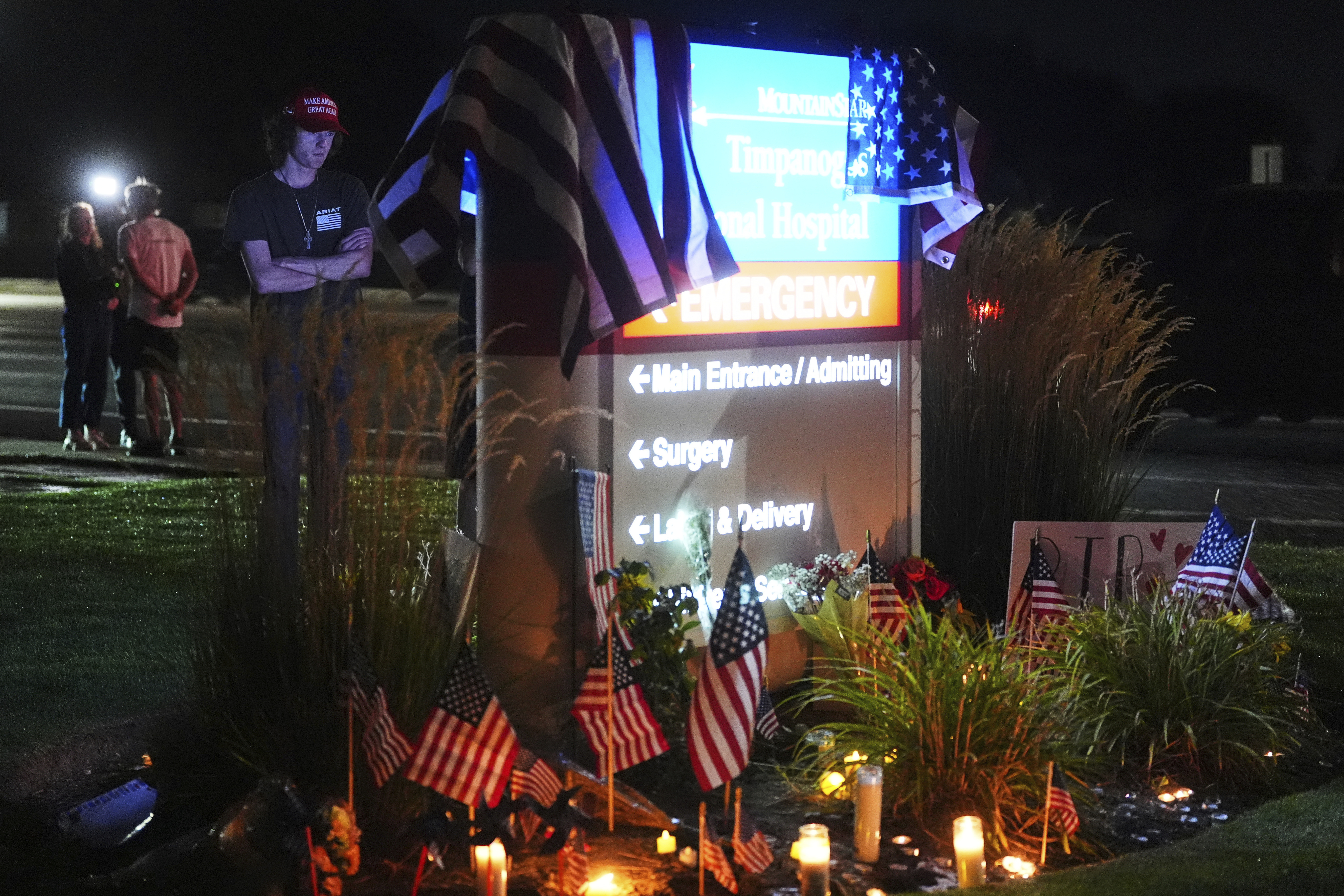Ammon Paxton, a supporter of Charlie Kirk who witnessed the event as Kirk was shot and killed, visits a growing memorial outside Timpanogos Regional Hospital, Wednesday, Sept. 10, 2025, in Orem, Utah. (Lindsey Wasson - AP)