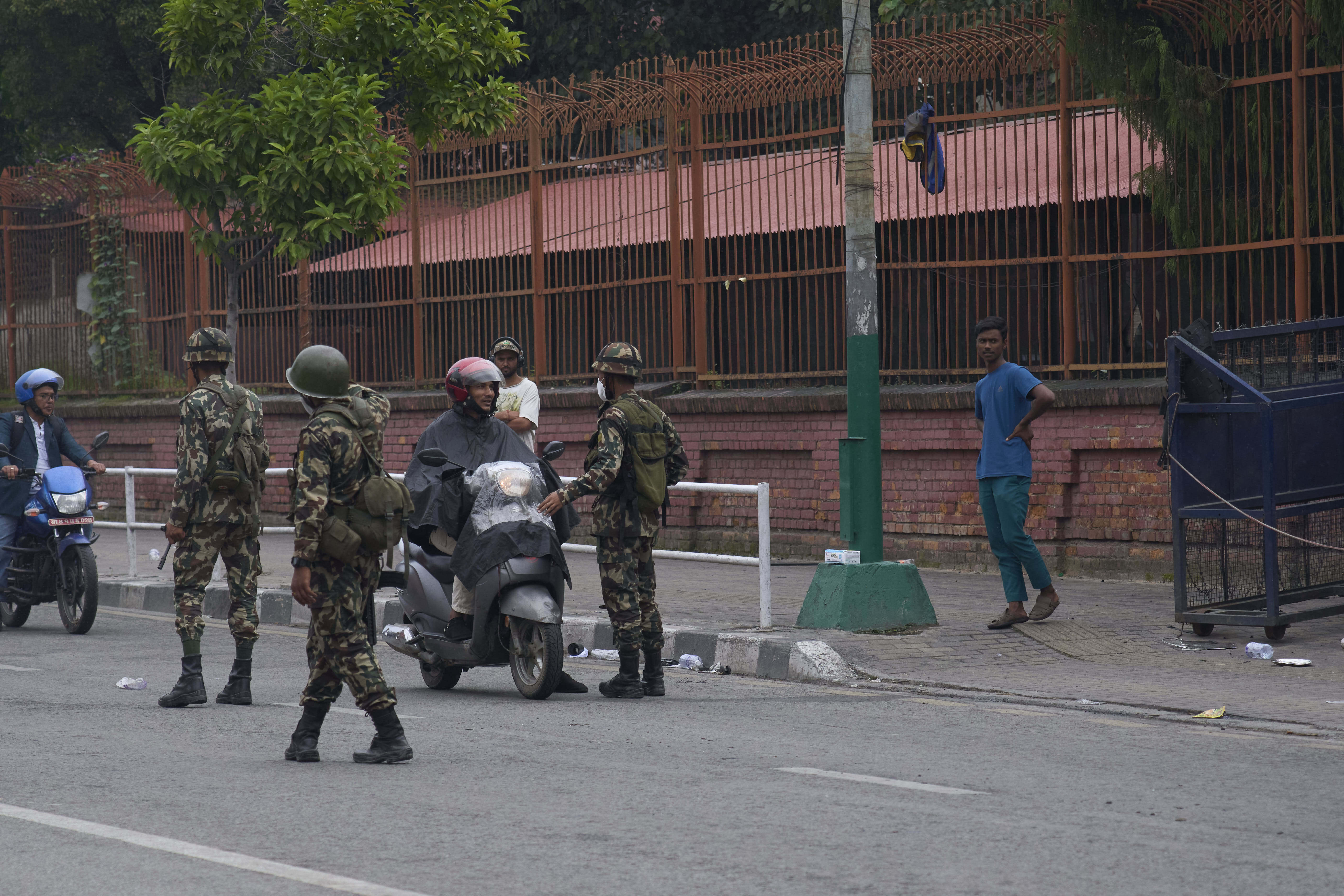 Nepalese army personnel check and question civilians at a checkpoint in Kathmandu, Nepal, Wednesday, Sept. 10, 2025. (Niranjan Shrestha - AP)