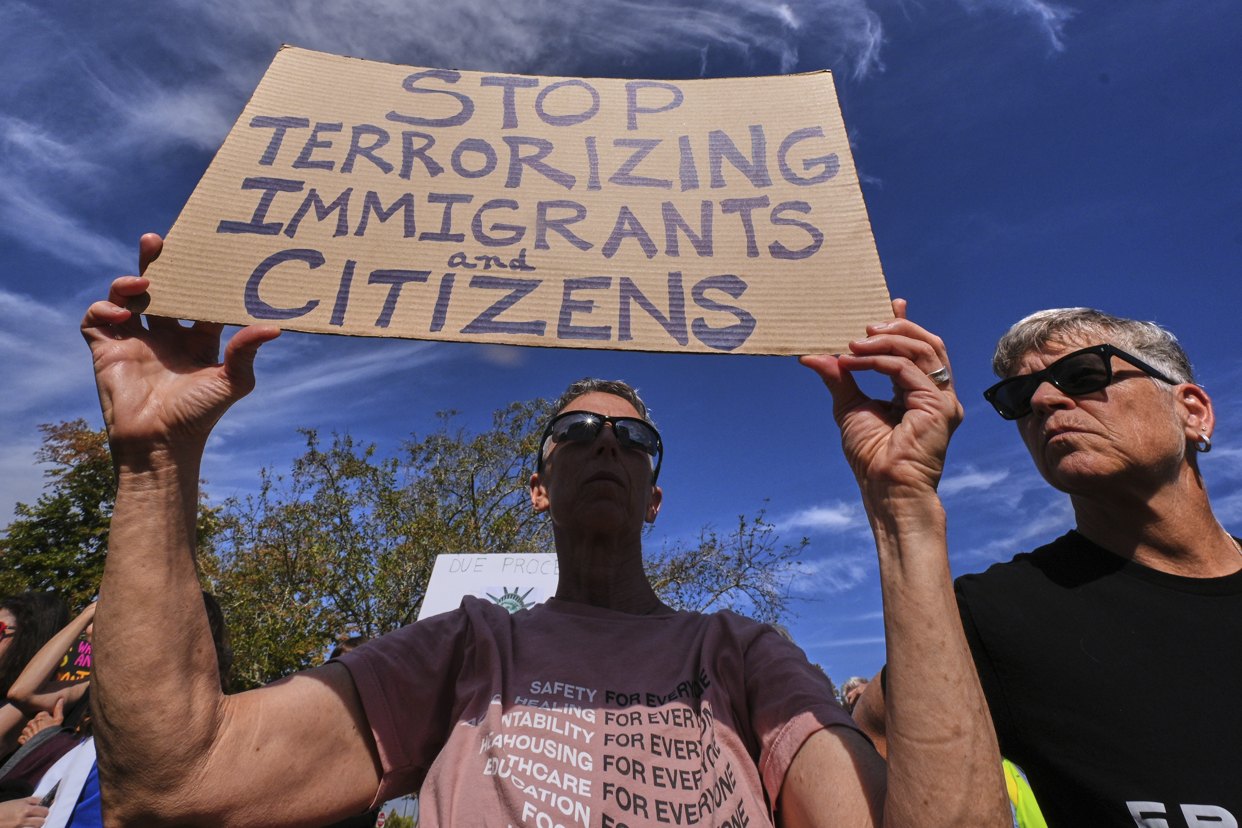 Protesters gather outside the U.S. Immigration and Customs Enforcement regional field office, Tuesday, Sept. 16, 2025, in Burlington, Mass. (Charles Krupa - AP)