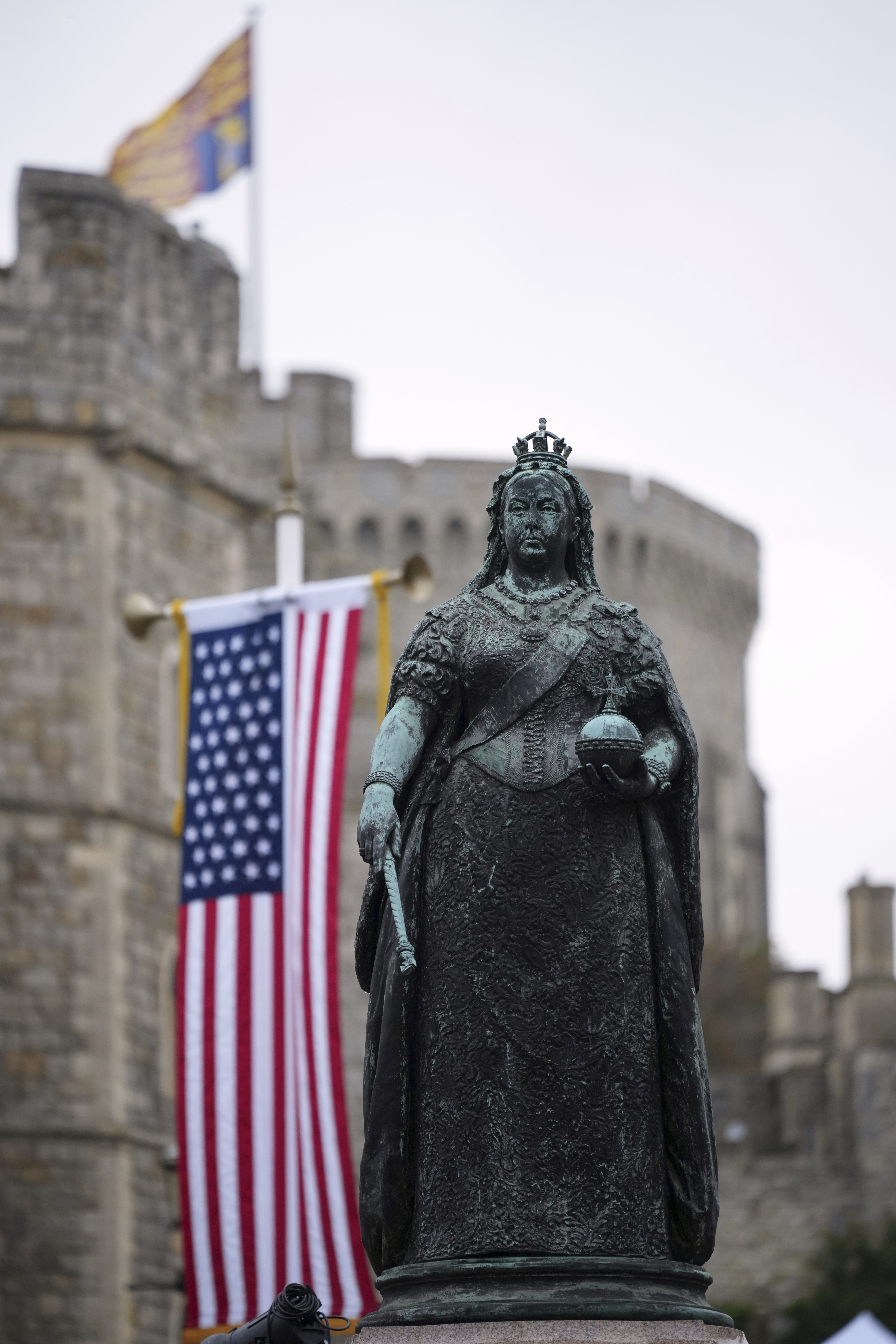 The Queen Victria Statue is seen beside the Flag of the United States of America in Windsor, England, Wednesday, Sept. 17, 2025 ahead of the arrival of President Donald Trump. (Alastair Grant - AP)