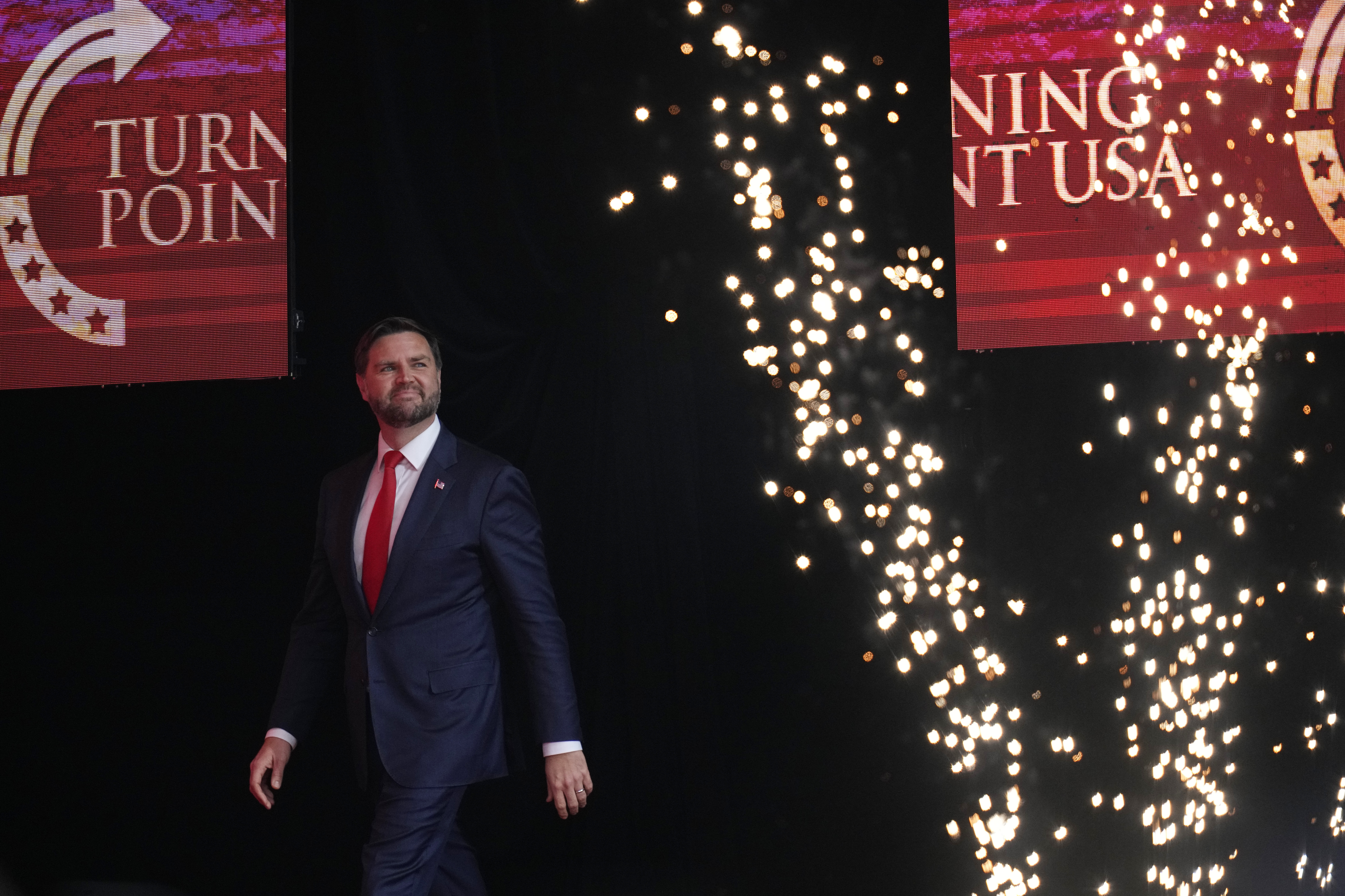 Vice President JD Vance arrives on stage to speak at a memorial for conservative activist Charlie Kirk, Sunday, Sept. 21, 2025, at State Farm Stadium in Glendale, Ariz. (John Locher - AP)
