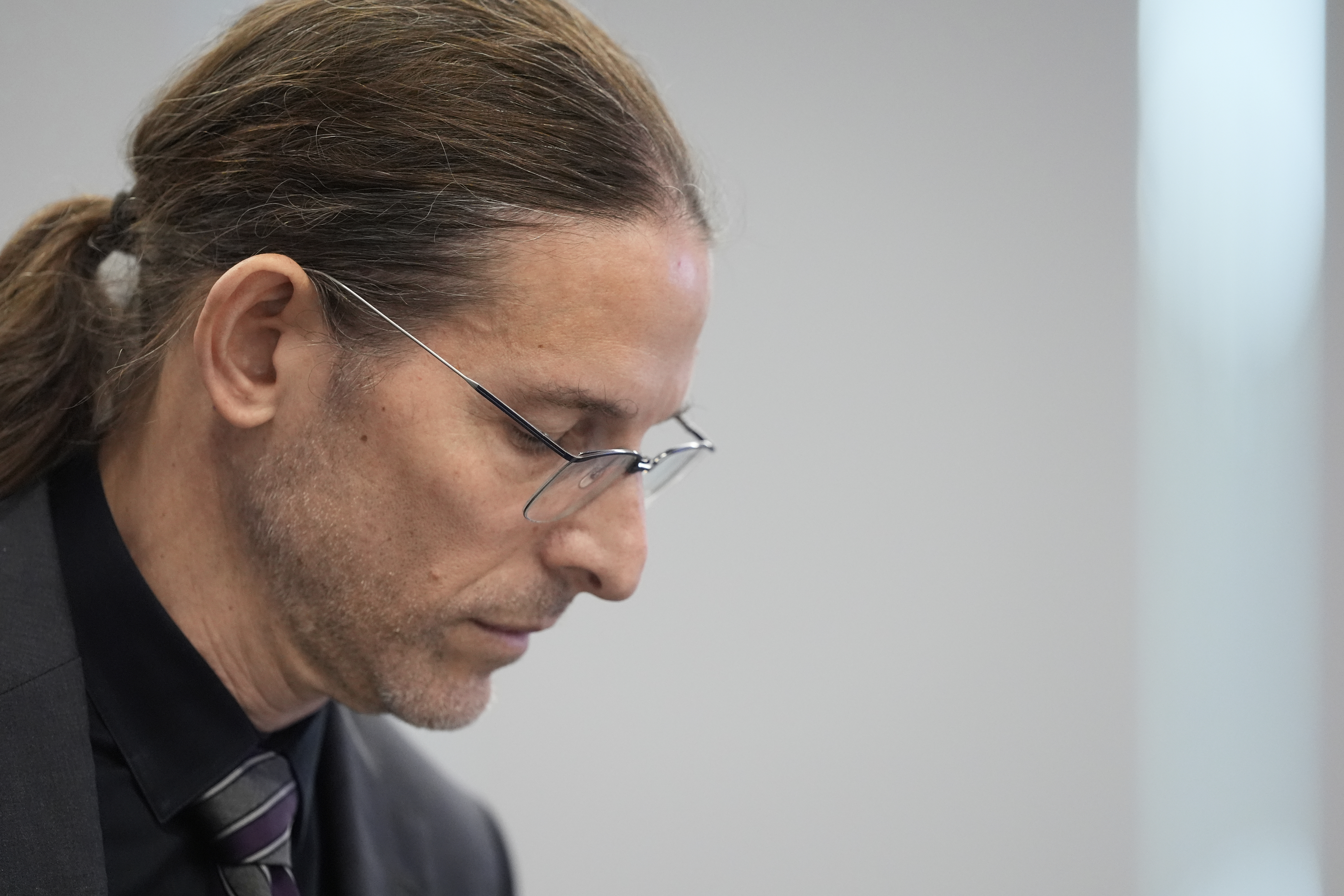 Committee member Dr. Retsef Levi listens during a meeting of the Advisory Committee on Immunization Practices at the CDC on Thursday, Sept. 18, 2025, in Chamblee, Ga. (Brynn Anderson - AP)