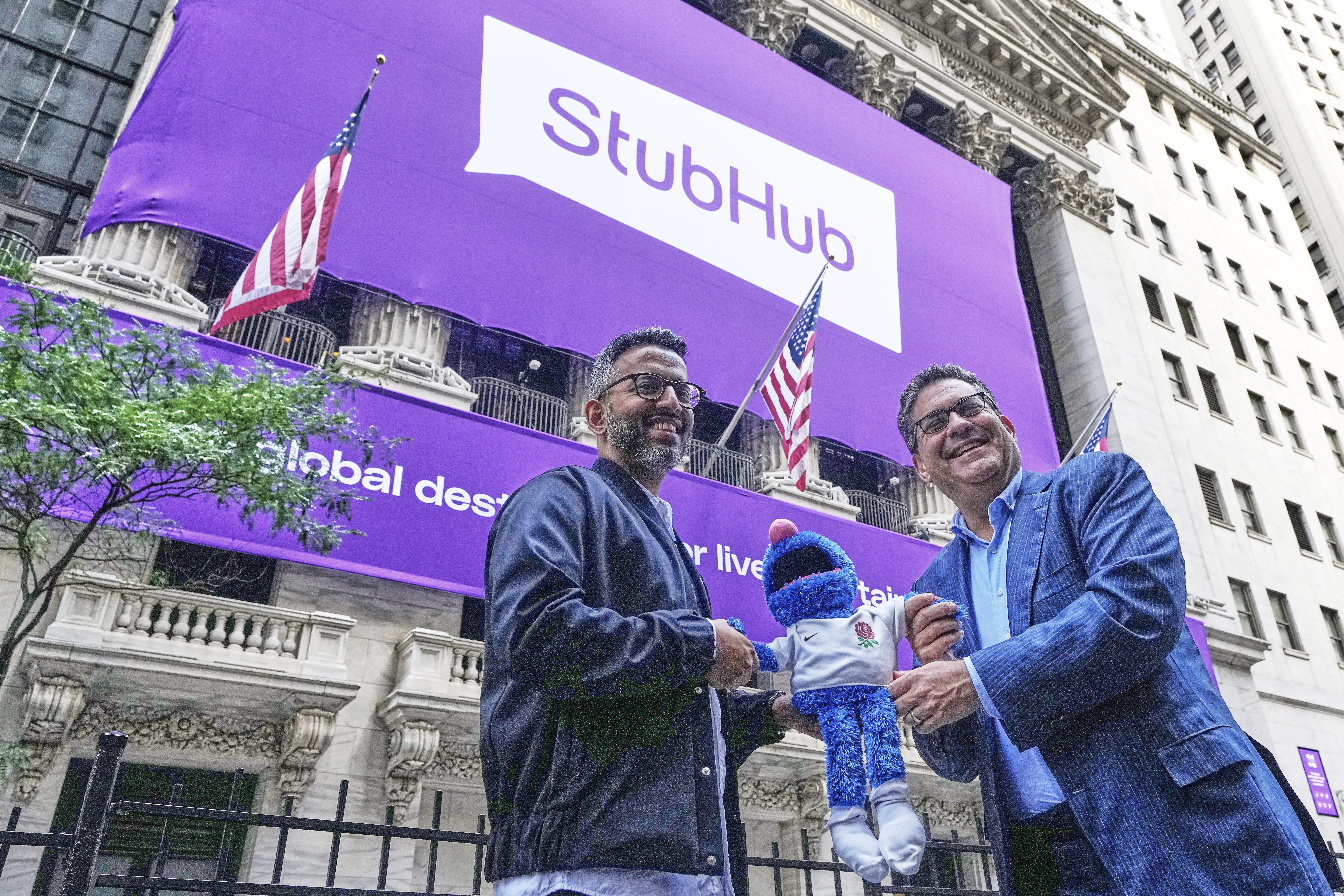 StubHub President Nayaab Islam, left, and CEO Eric Baker pose for photos outside the New York Stock Exchange before the company's IPO, Wednesday, Sept. 17, 2025. (Richard Drew - AP)