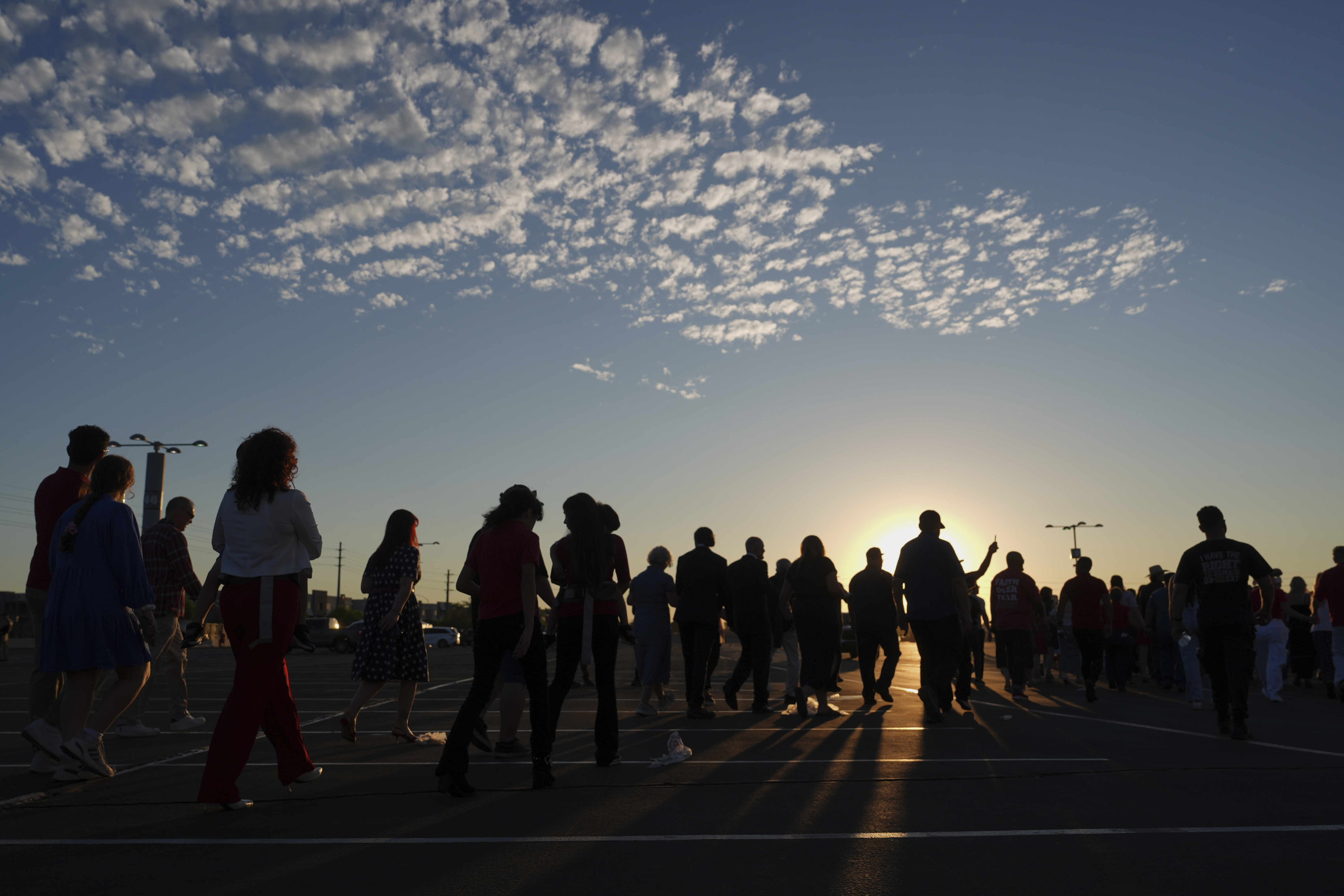 People wait in line before a memorial for conservative activist Charlie Kirk Sunday, Sept. 21, 2025, at State Farm Stadium in Glendale, Ariz. (Jae C. Hong - AP)