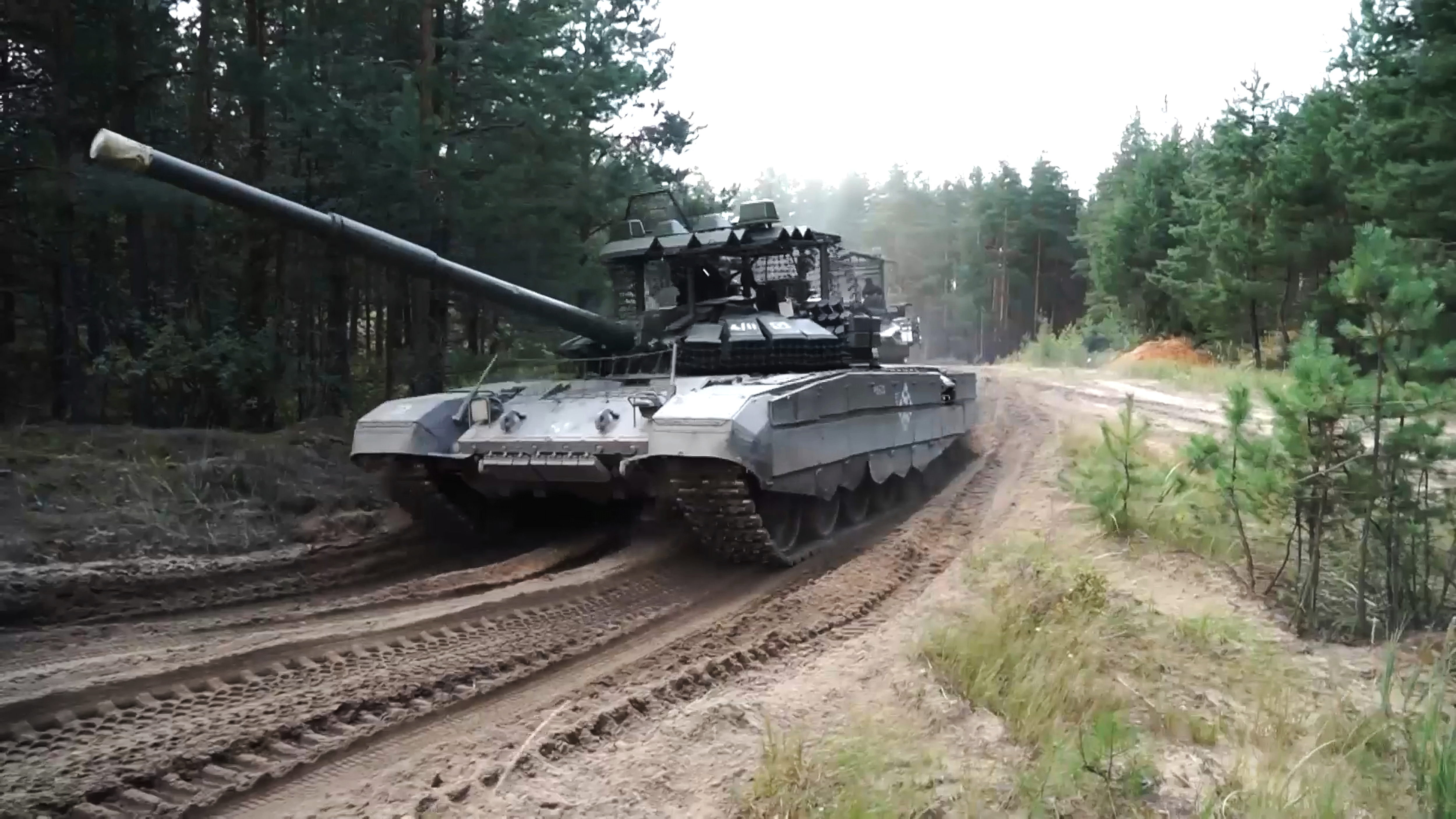In this photo taken from video distributed by Russian Defense Ministry Press Service on Friday, Sept. 12, 2025, Armored vehicles drive during joint military drills held by Russia and Belarus. (Uncredited - Russian Defense Ministry Press Service)