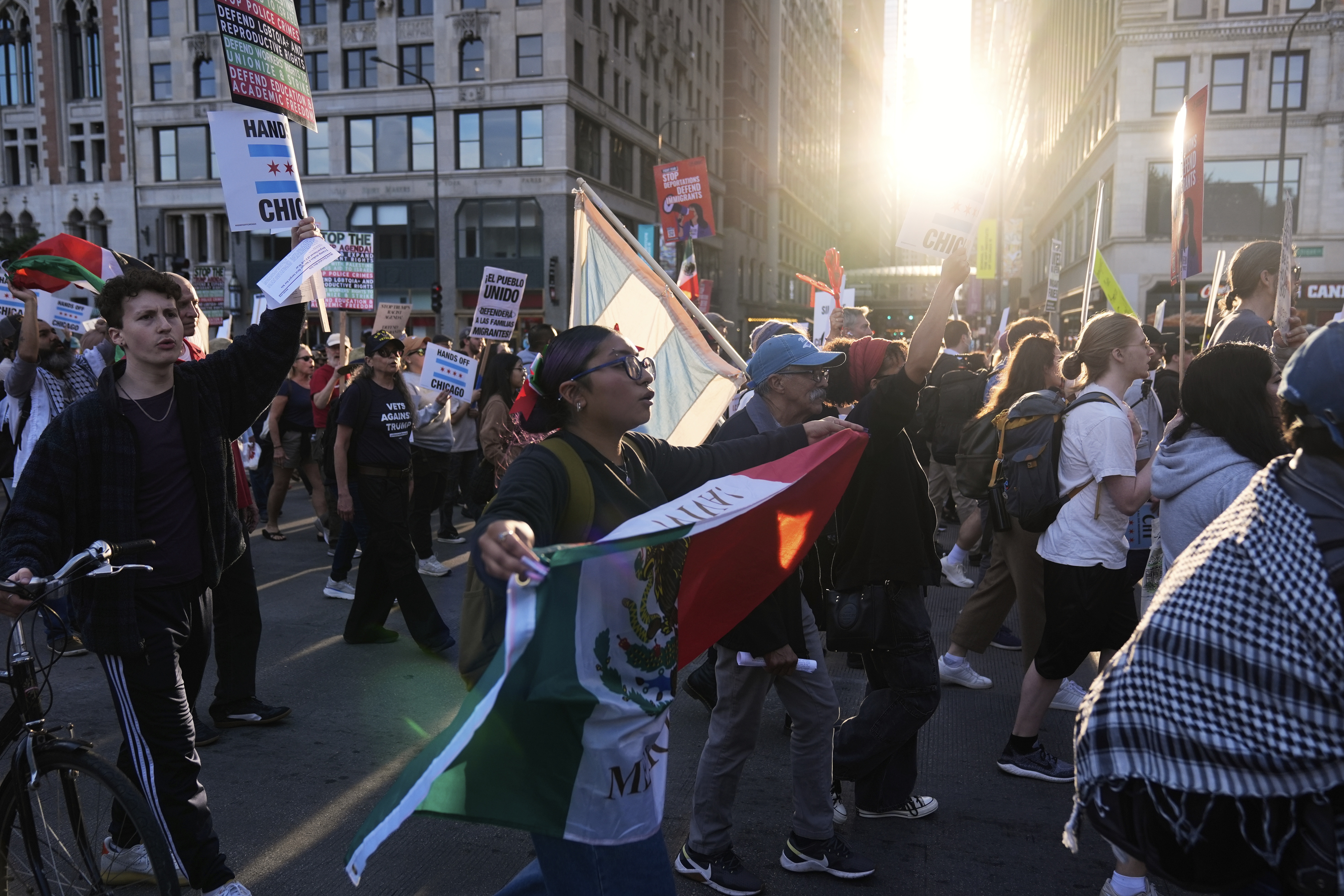 Demonstrators march at a protest opposing 