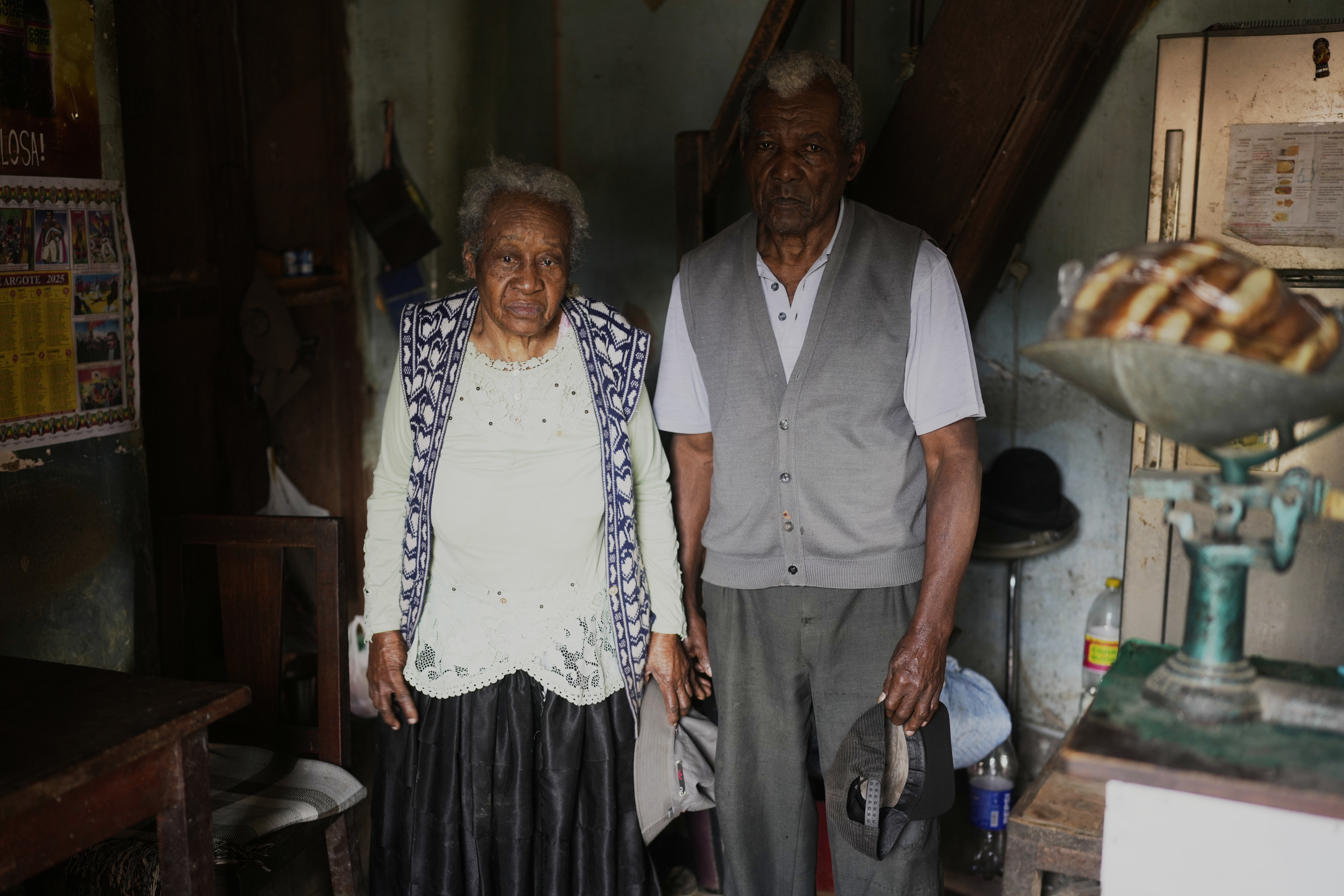 Julio Pinedo, a symbolic leader regarded as the king of the Afro-Bolivians, and his wife Angelica Larrea, pose for a photo in their home in Mururata, Bolivia, Sunday, Aug. 3, 2025. (Juan Karita - AP)