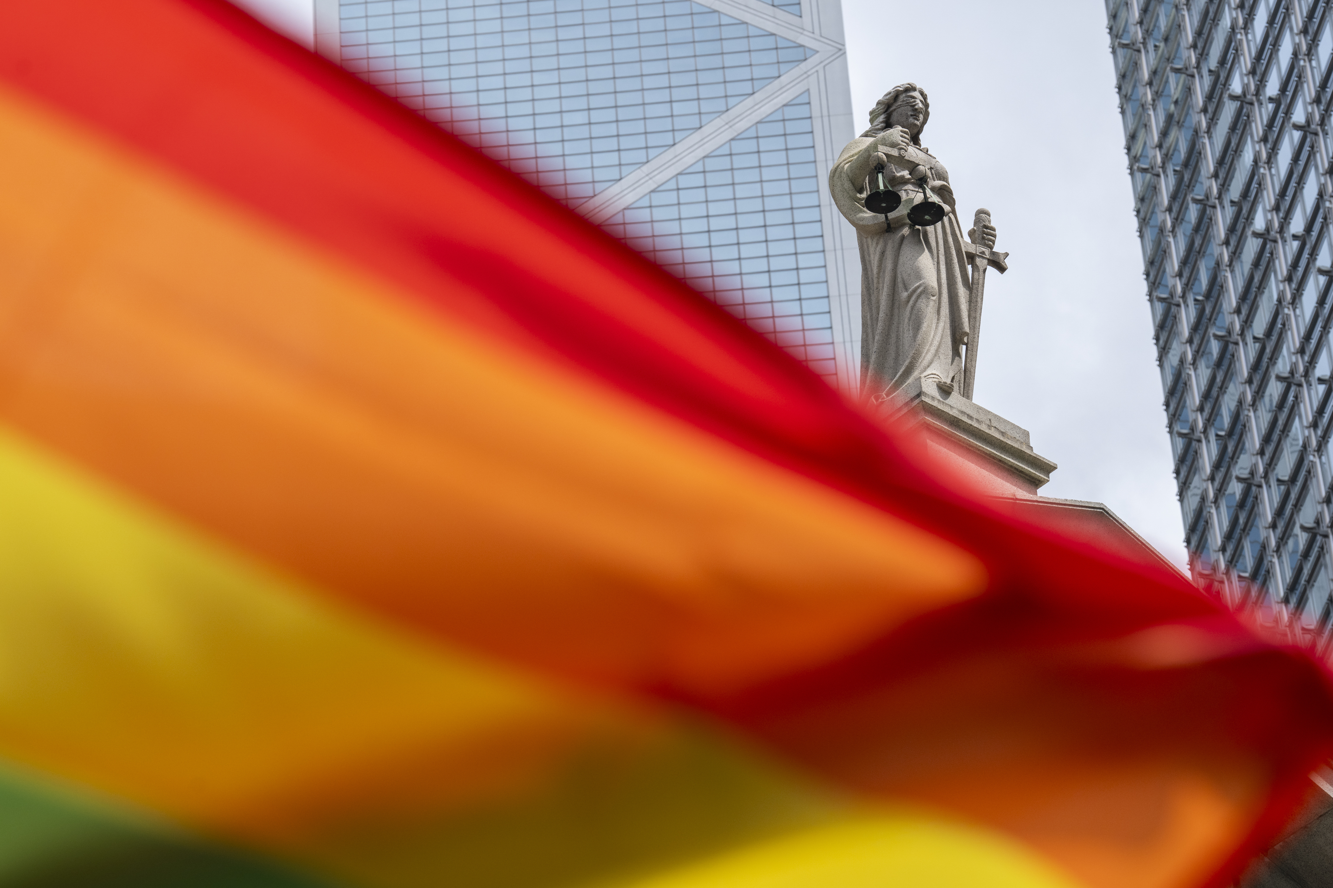 A rainbow flag is posed for photos in front of the court of final appeal in Hong Kong, Sunday, Aug. 24, 2025. (Chan Long Hei - AP)