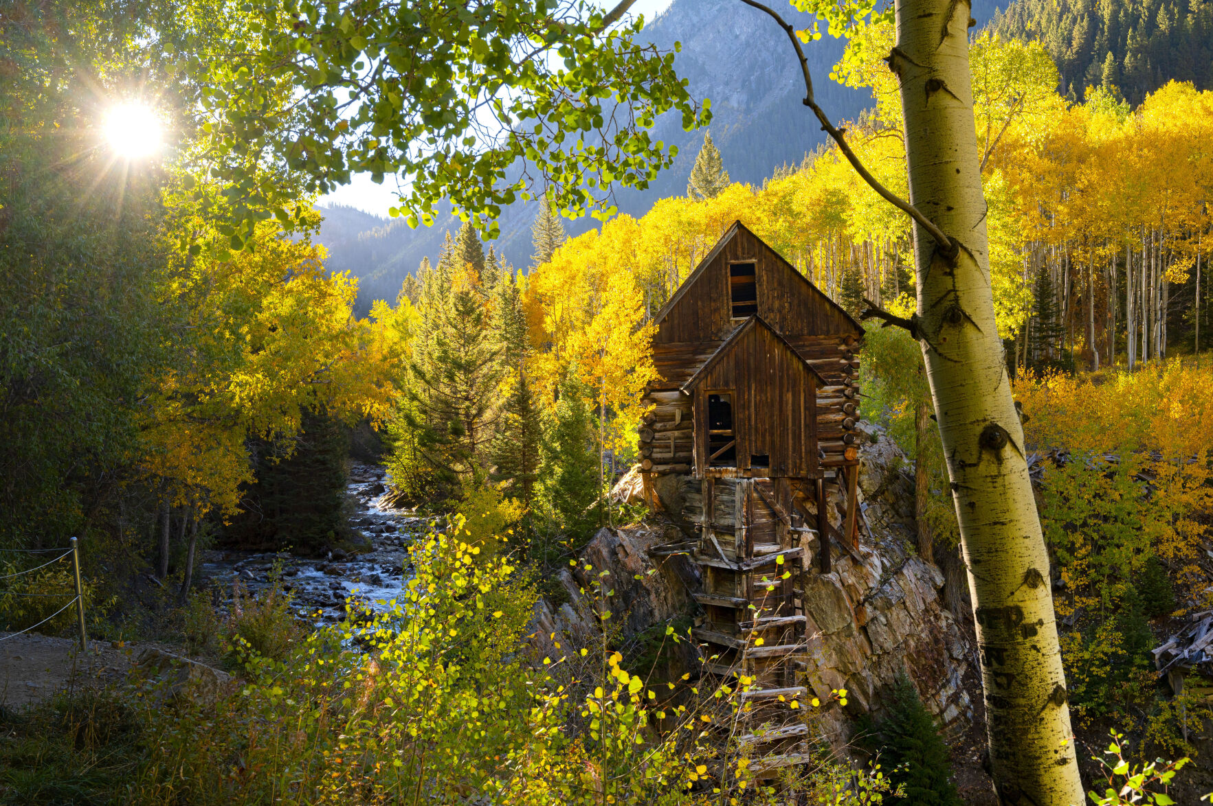 Beautiful Colorado. The rising sun highlights the turning aspens surrounding the Crystal Mill near Marble, Colo., Tuesday, Sept. 29, 2020. The mill was built in 1893 to power the air compressor to run drills in the nearby Sheep Mountain and Bear Mountain mines. It closed in 1917. Today it’s one of the most photographed spots in Colorado. (The Gazette, Christian Murdock) (Christian Murdock/The Gazette)