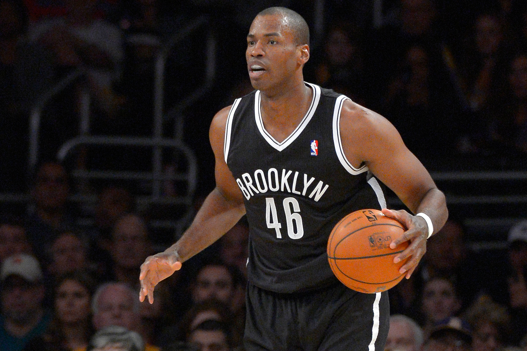 FILE - Brooklyn Nets center Jason Collins dribbles the ball during the second half of an NBA basketball game against the Los Angeles Lakers, Sunday, Feb. 23, 2014, in Los Angeles. (Mark J. Terrill - AP)