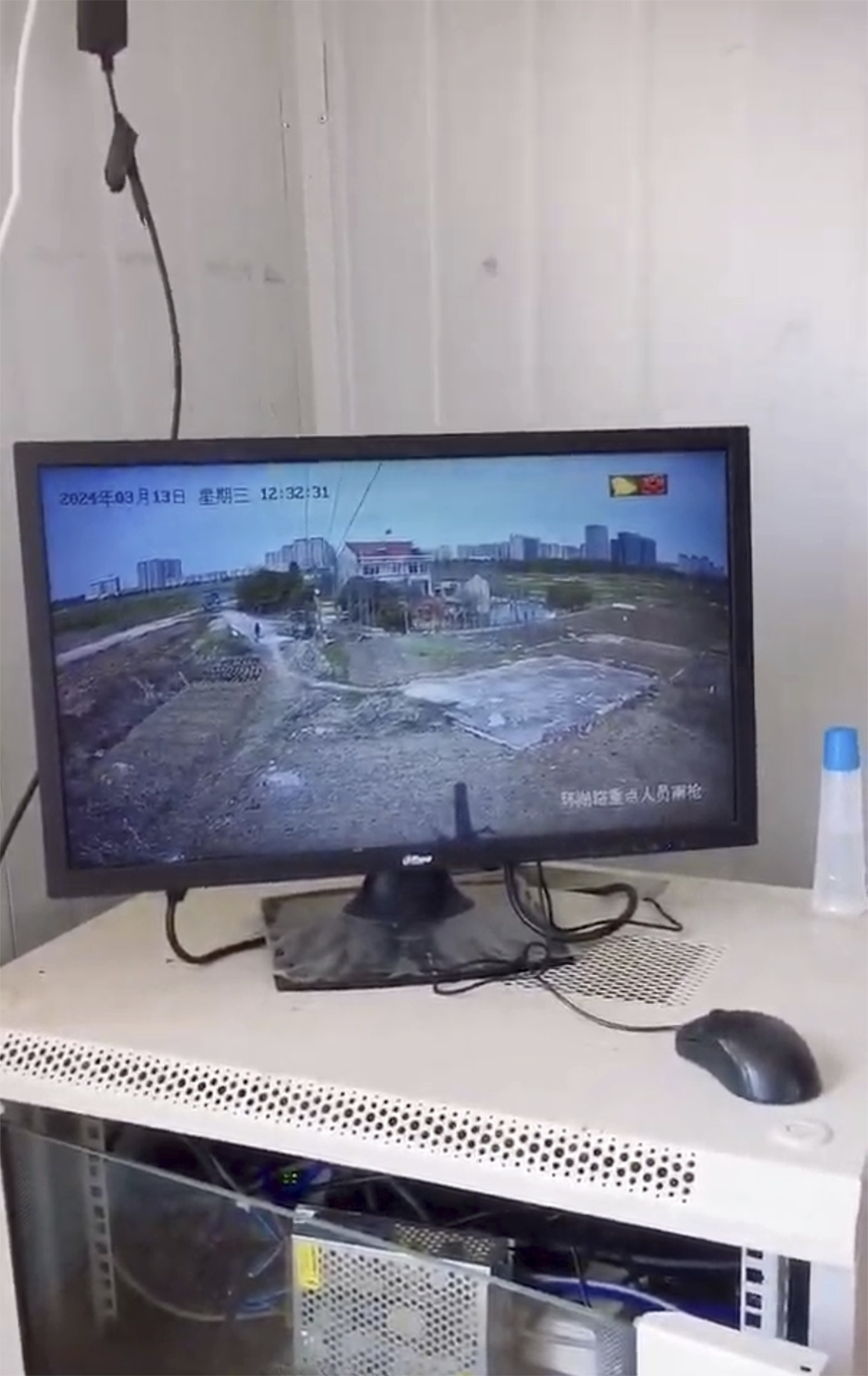 In this screen grab image from video, a monitor shows the surveillance of the Yang home from a police post set up across the street, Wednesday, March, 13, 2024, in Changzhou in eastern China's Jiangsu Province. (Yang Family - Yang Family)
