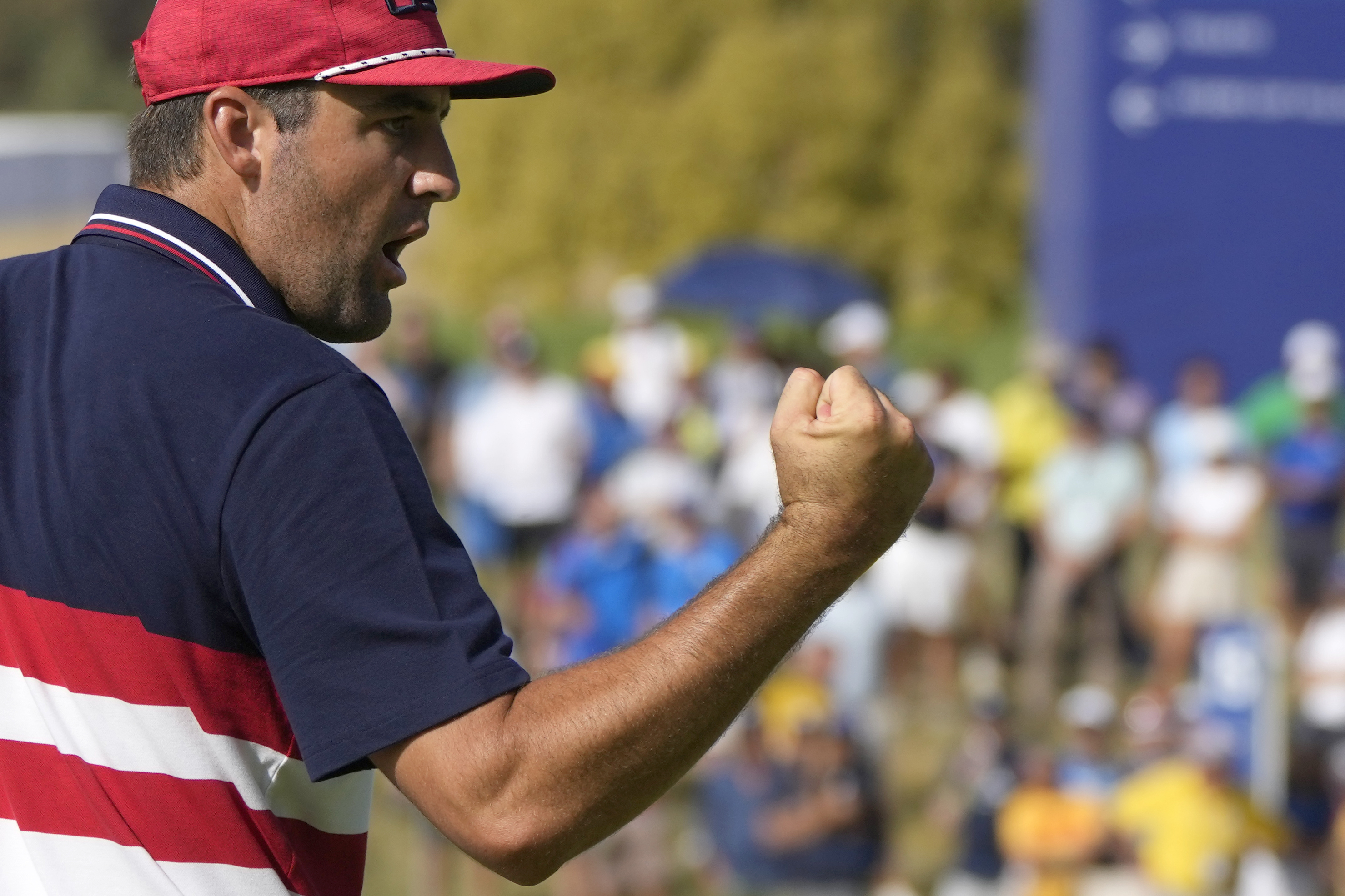 FILE - United States' Scottie Scheffler celebrates after putting on the 14th green during his singles match at the Ryder Cup golf tournament at the Marco Simone Golf Club in Guidonia Montecelio, Italy, Sunday, Oct. 1, 2023. (Alessandra Tarantino - AP)