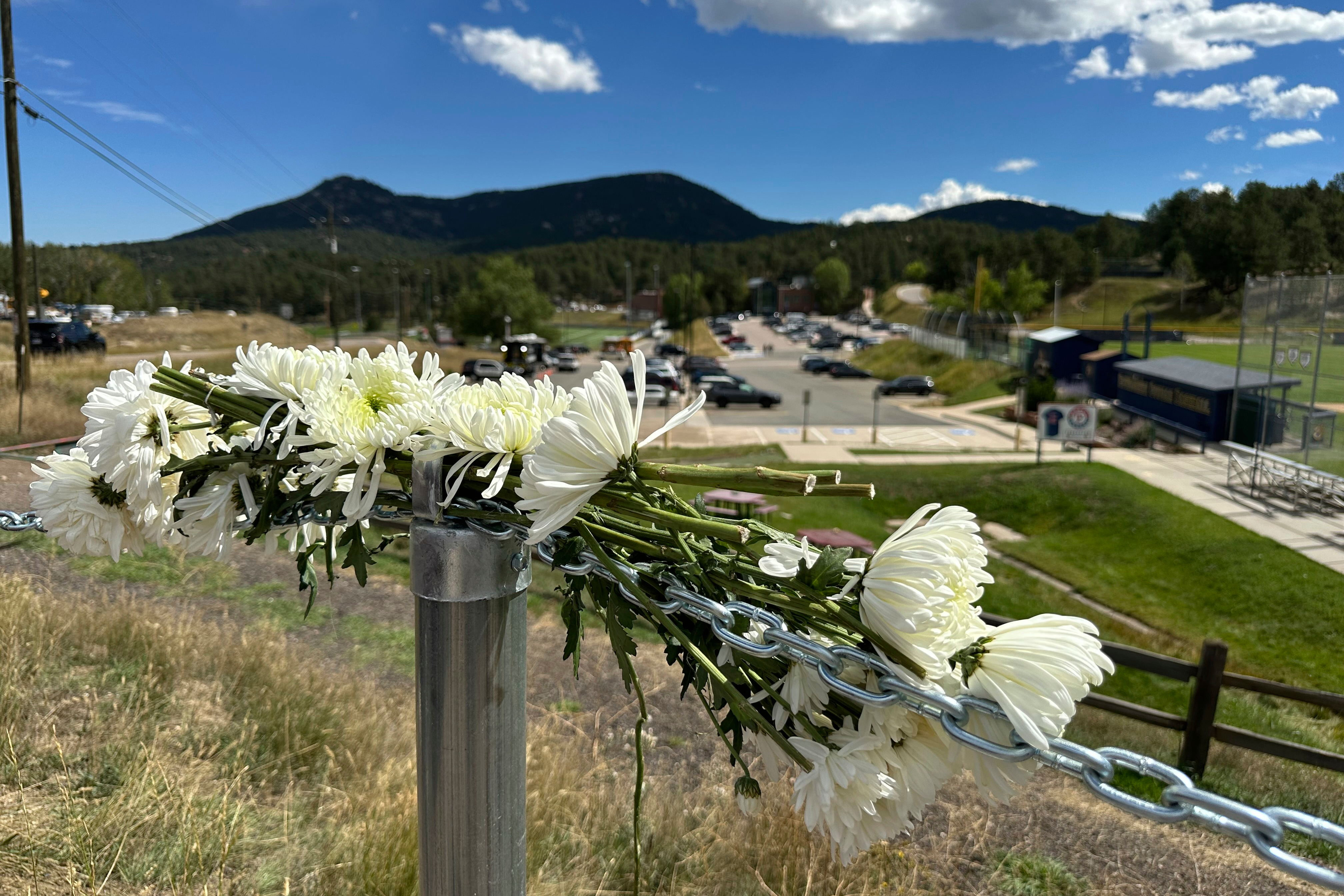 Flowers are left in remembrance of those wounded in a shooting at Evergreen High School in Evergreen, Colo., Thursday, Sept. 11, 2025. (Colleen Slevin - AP)