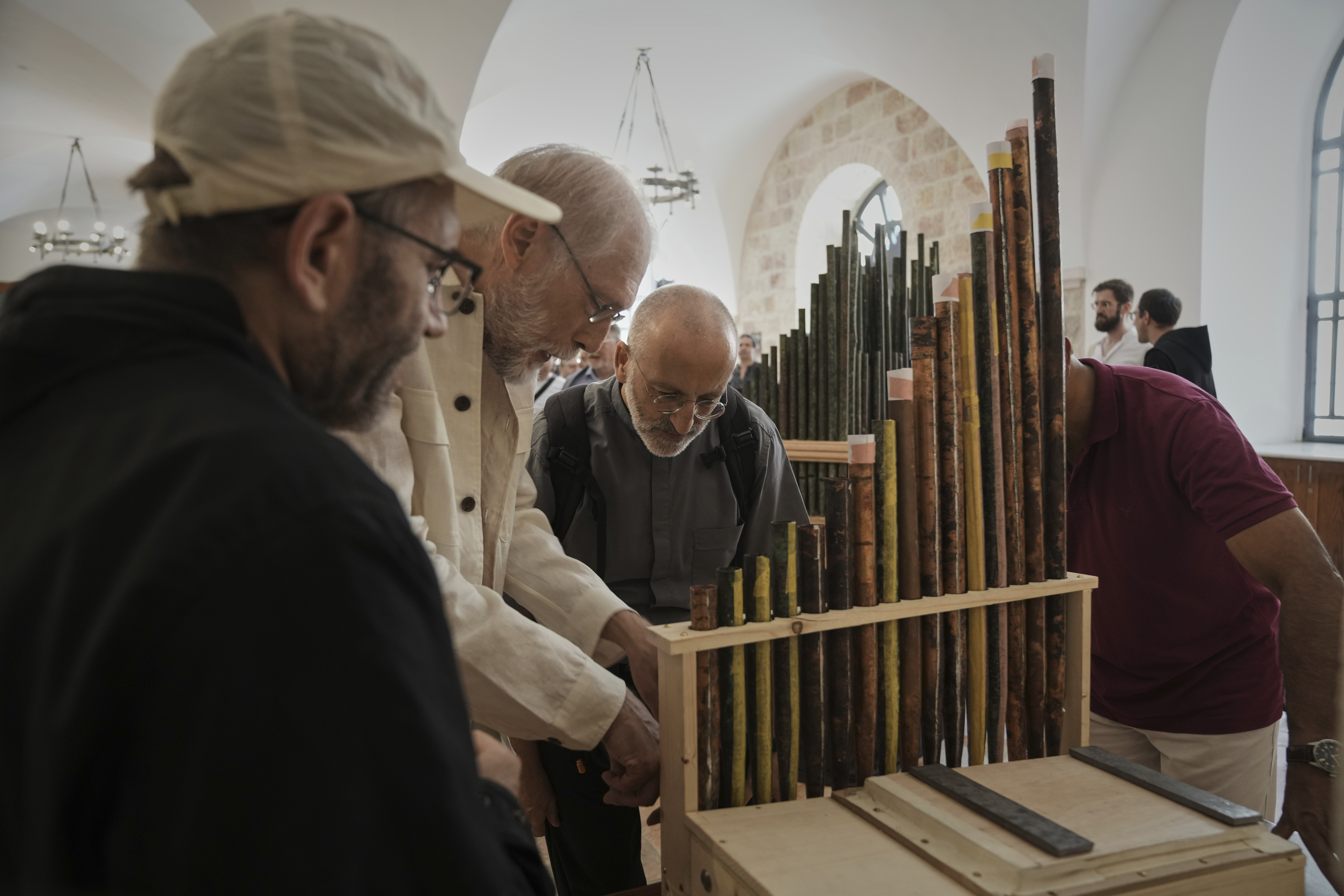 People look at an 11th-century organ that researchers say is the oldest in the Christian world was played for the first time in 800 years after restoration, in Saint Savior's Monastery of Jerusalem's Old City, Tuesday, Sept. 9, 2025. (Mahmoud Illean - AP)