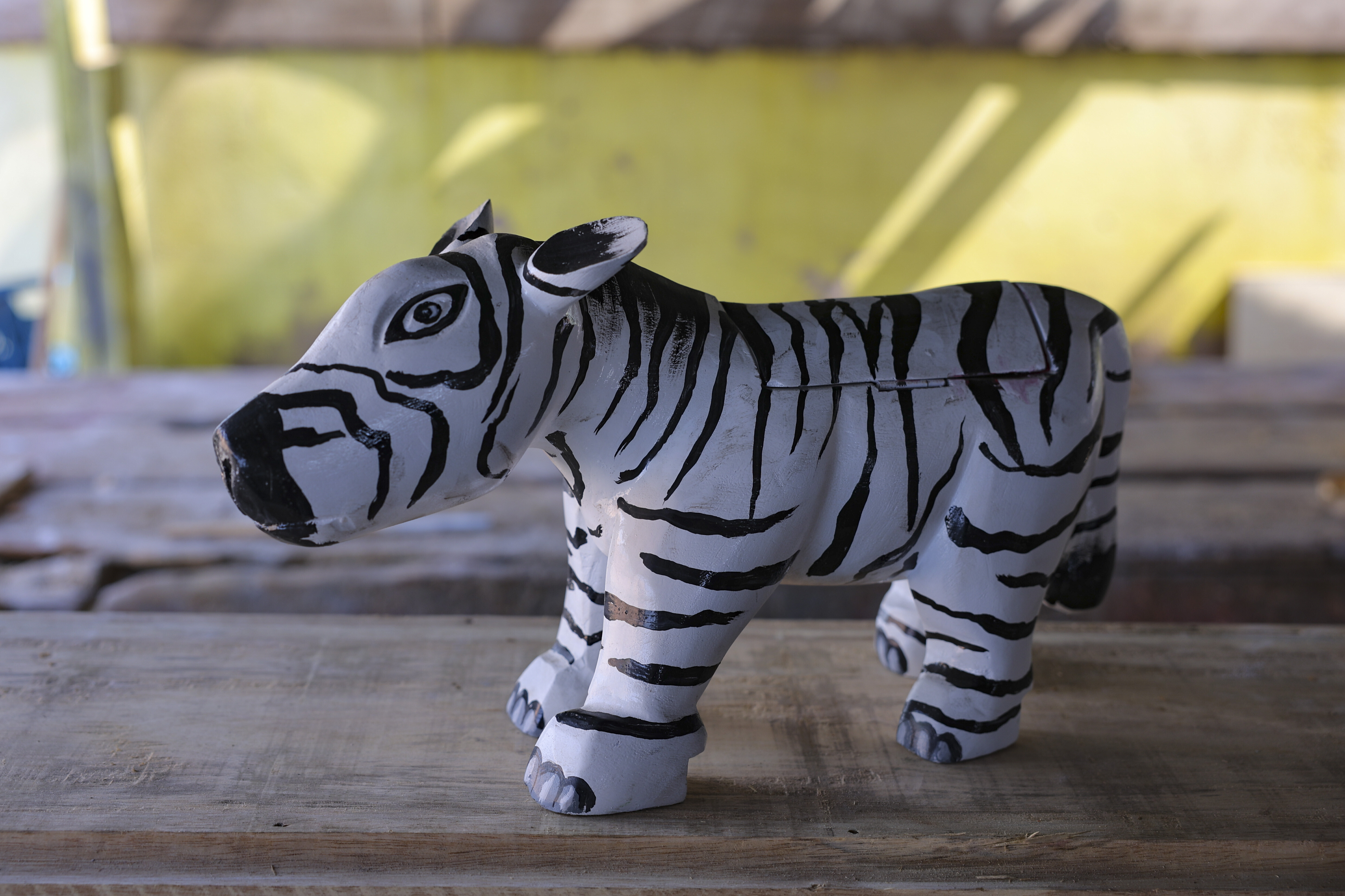 A miniature zebra fantasy coffin prototype crafted by Eric Kpakpo Adotey is displayed in his shop in La, Accra, Ghana, Friday, July 25, 2025. (Misper Apawu - AP)
