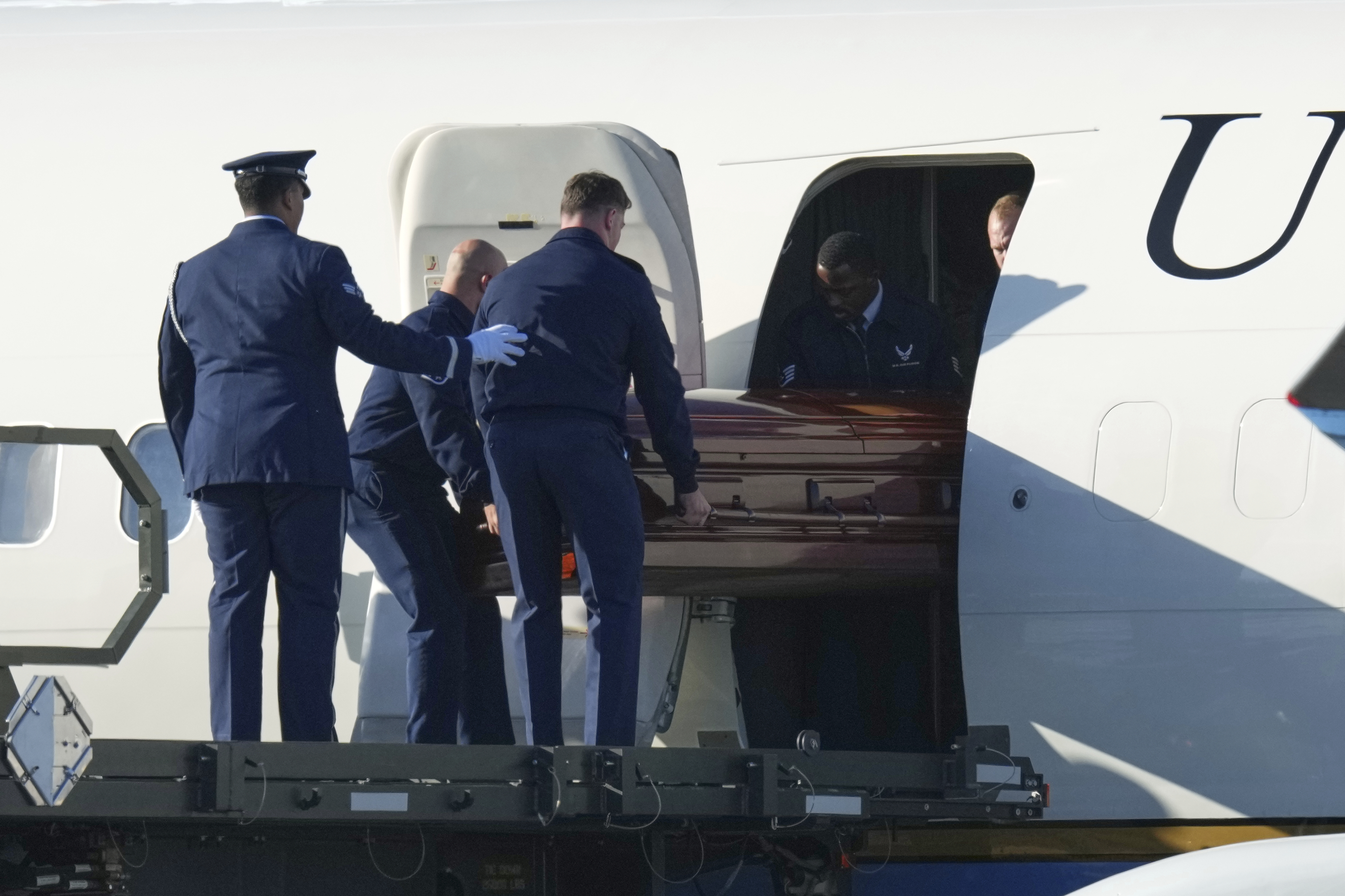 The casket containing the body of Charlie Kirk, the CEO and co-founder of Turning Point USA who was shot and killed is removed from Air Force Two at Phoenix Sky Harbor International Airport, Thursday, Sept. 11, 2025, in Phoenix. (Ross D. Franklin - AP)