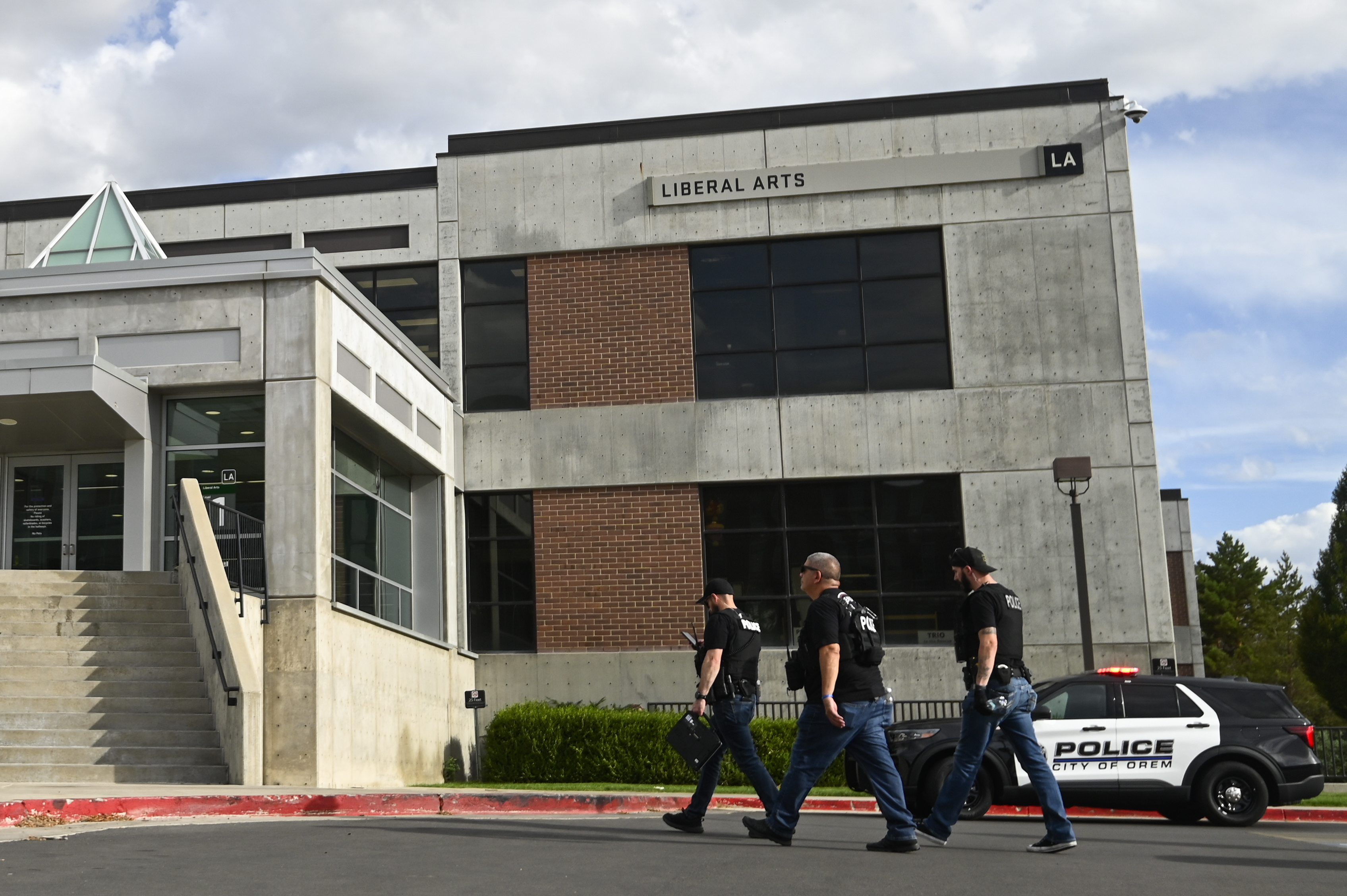 Law enforcement enters a building at Utah Valley University on Wednesday, Sept. 10, 2025, in Orem, Utah. (Alex Goodlett - FR171569 AP)