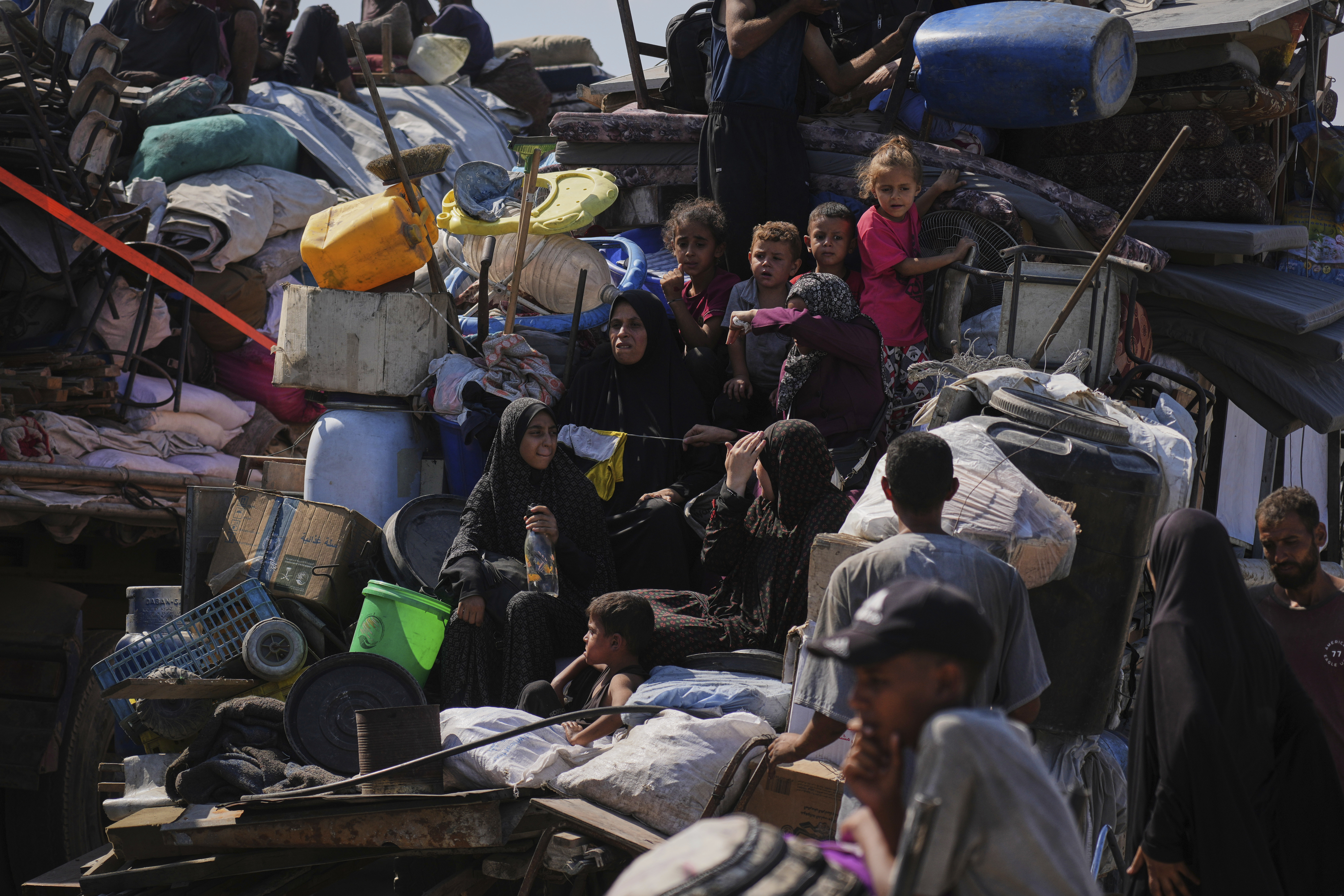 Displaced Palestinians flee Gaza City by foot and vehicles, carrying their belongings along the coastal road toward southern Gaza, Wednesday, Sept. 17, 2025. (Abdel Kareem Hana - AP)