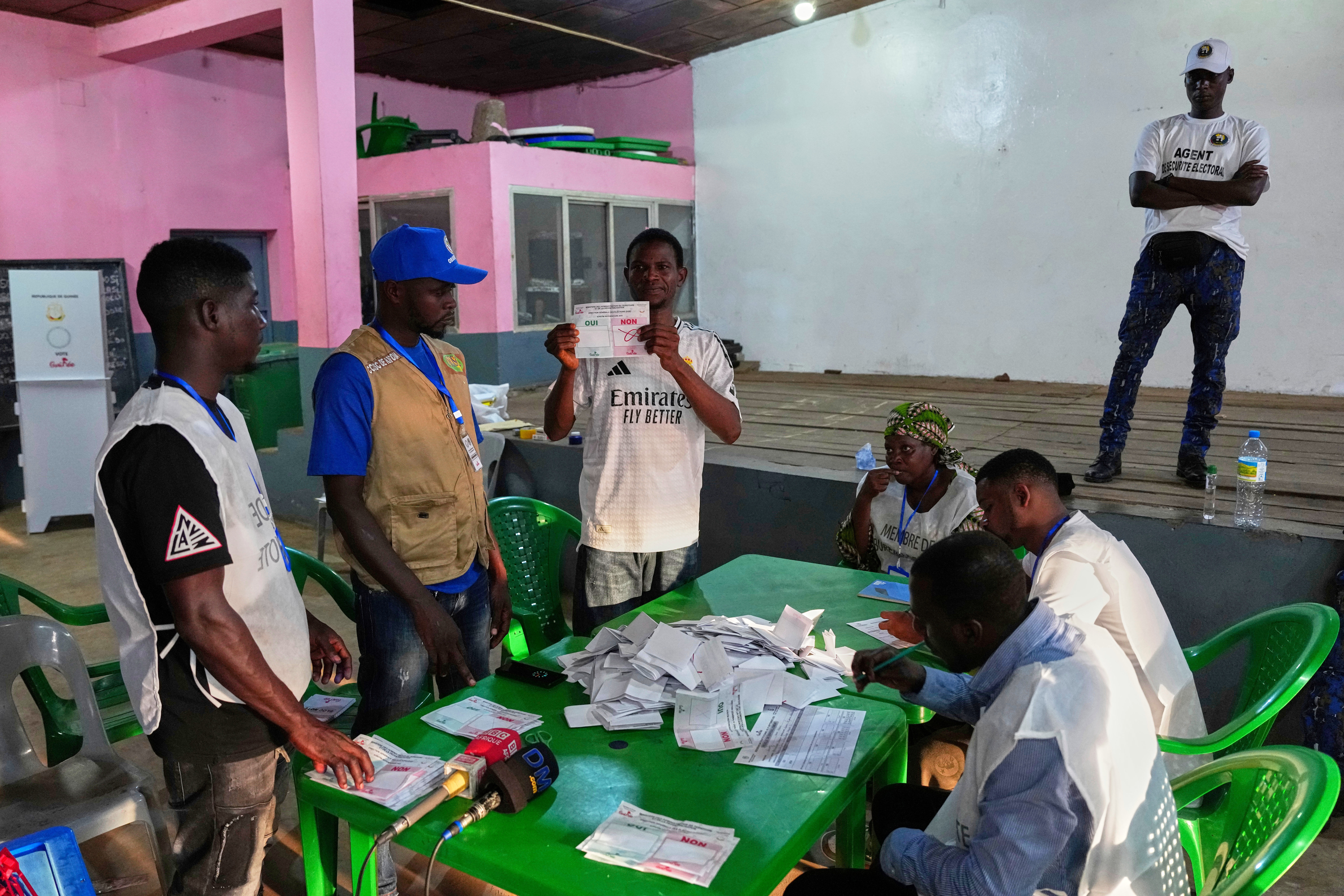Officials count ballots at a polling station as polls close during the constitutional referendum in Conakry, Guinea, Sunday, Sept. 21, 2025. (Misper Apawu - AP)
