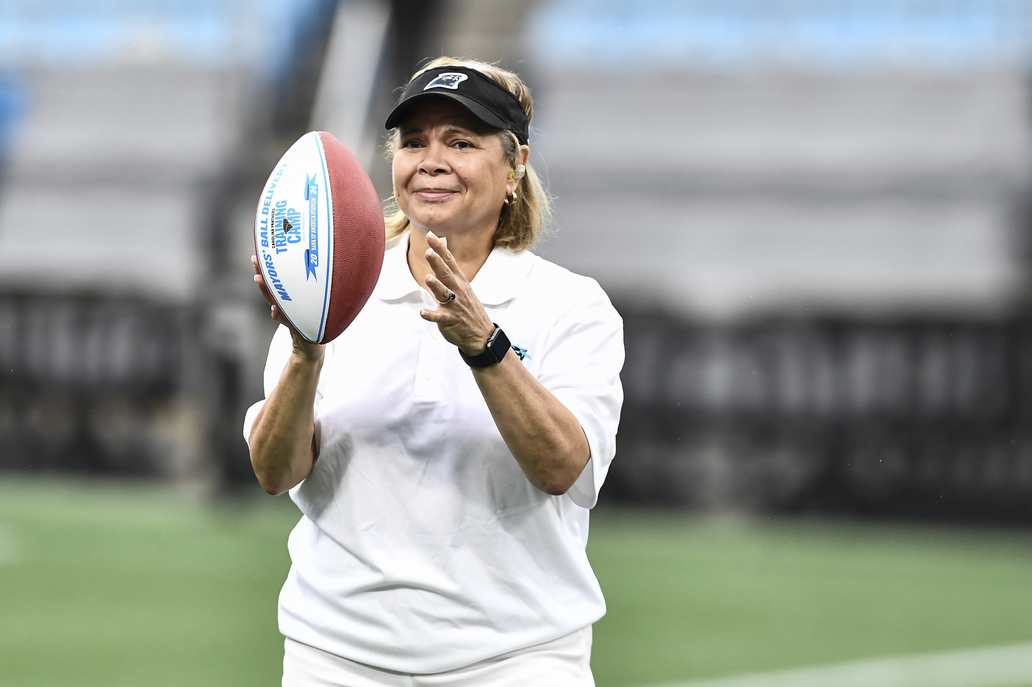 FILE - Charlotte Mayor Vi Lyles catches a Carolina Panthers football during the NFL football team's training camp in Charlotte, N.C., July 27, 2024. (Matt Kelley - FR171845 AP)