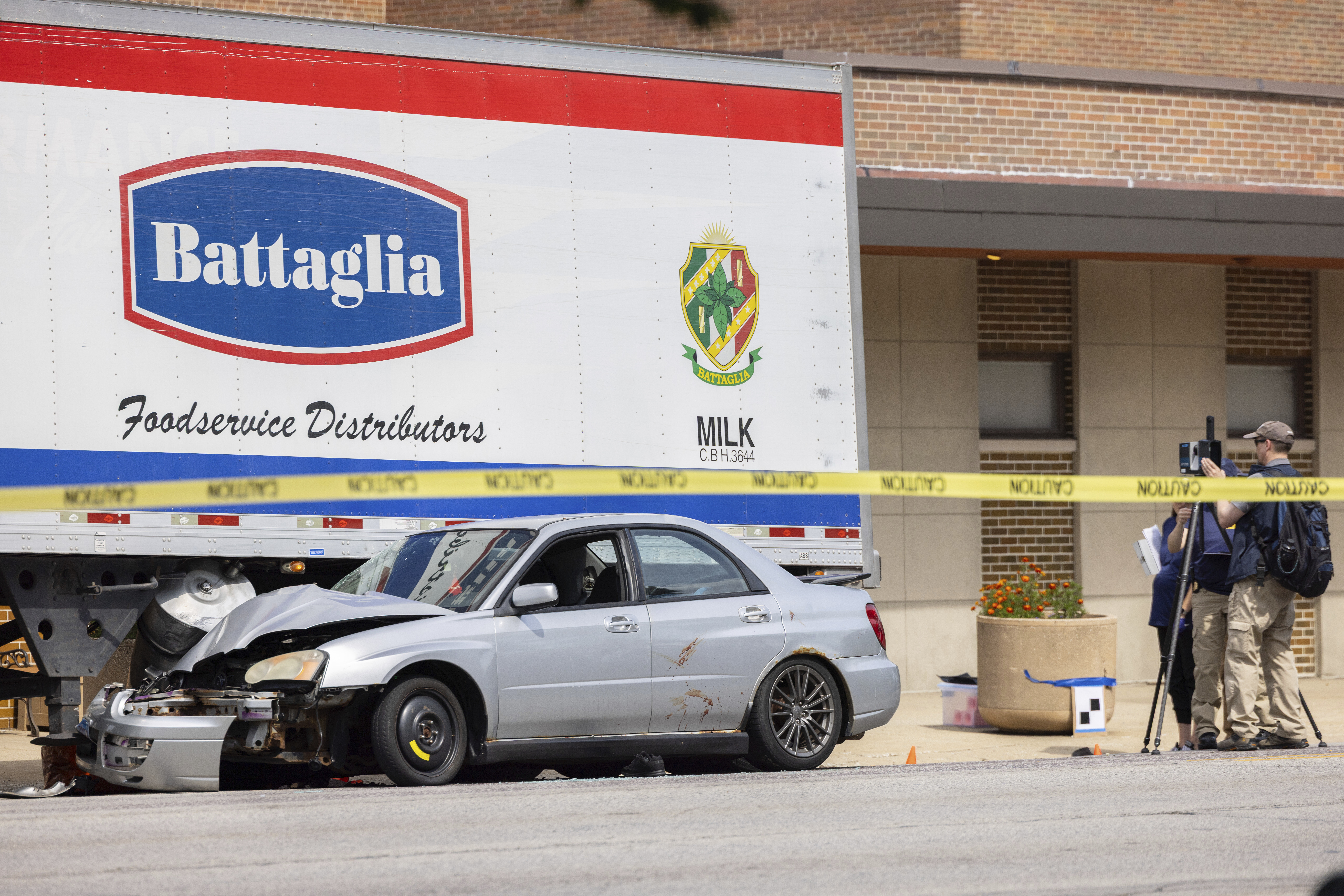 Law enforcement personnel investigate after the Department of Homeland Security said an Immigration and Customs Enforcement agent fatally shot a man in the Franklin Park suburb of Chicago on Friday, Sept. 12, 2025. (Candace Dane Chambers - Chicago Sun-Times)