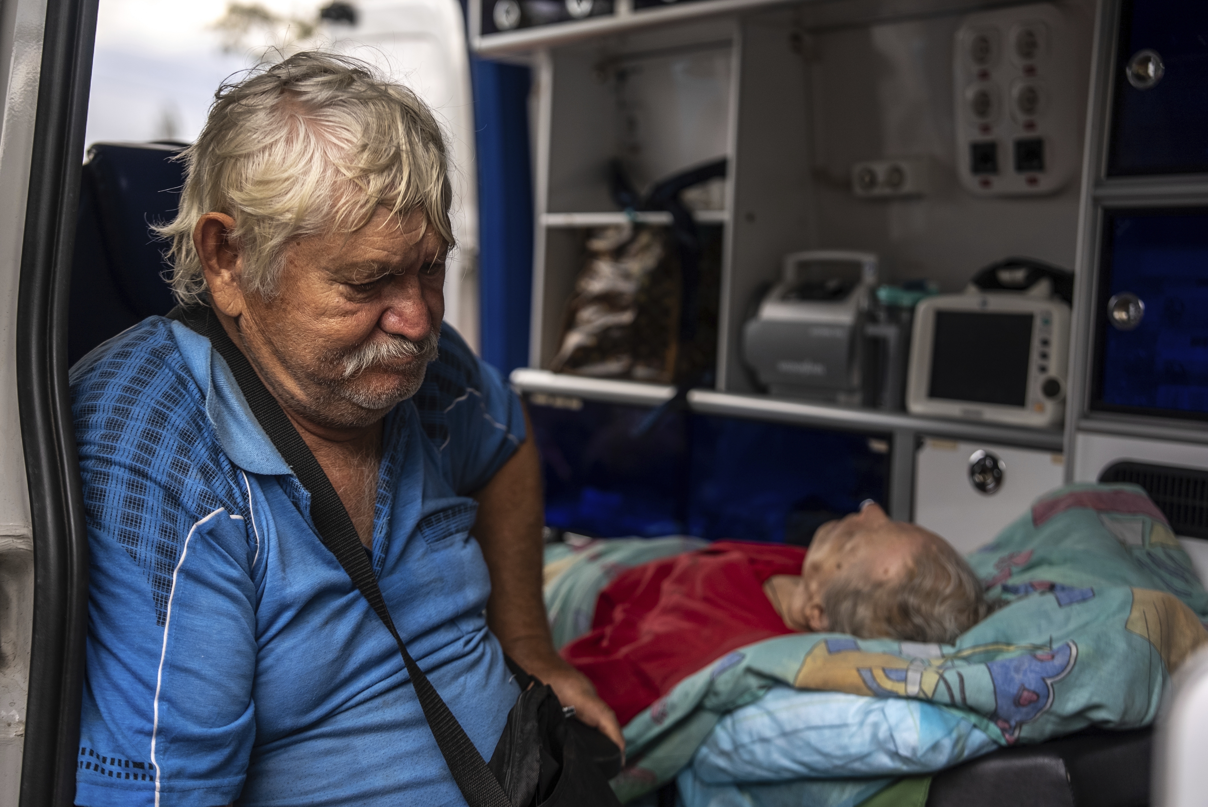 Myrola Puzyk, 70, who lost his wife Tetiana Puzyk, 68, who was killed while she was receiving her pension in the village of Yarova during a Russian aerial strike, seats in the ambulance during evacuation in Sloviansk, Donetsk region, Tuesday, Sept.9, 2025. (Alex Babenko - AP)