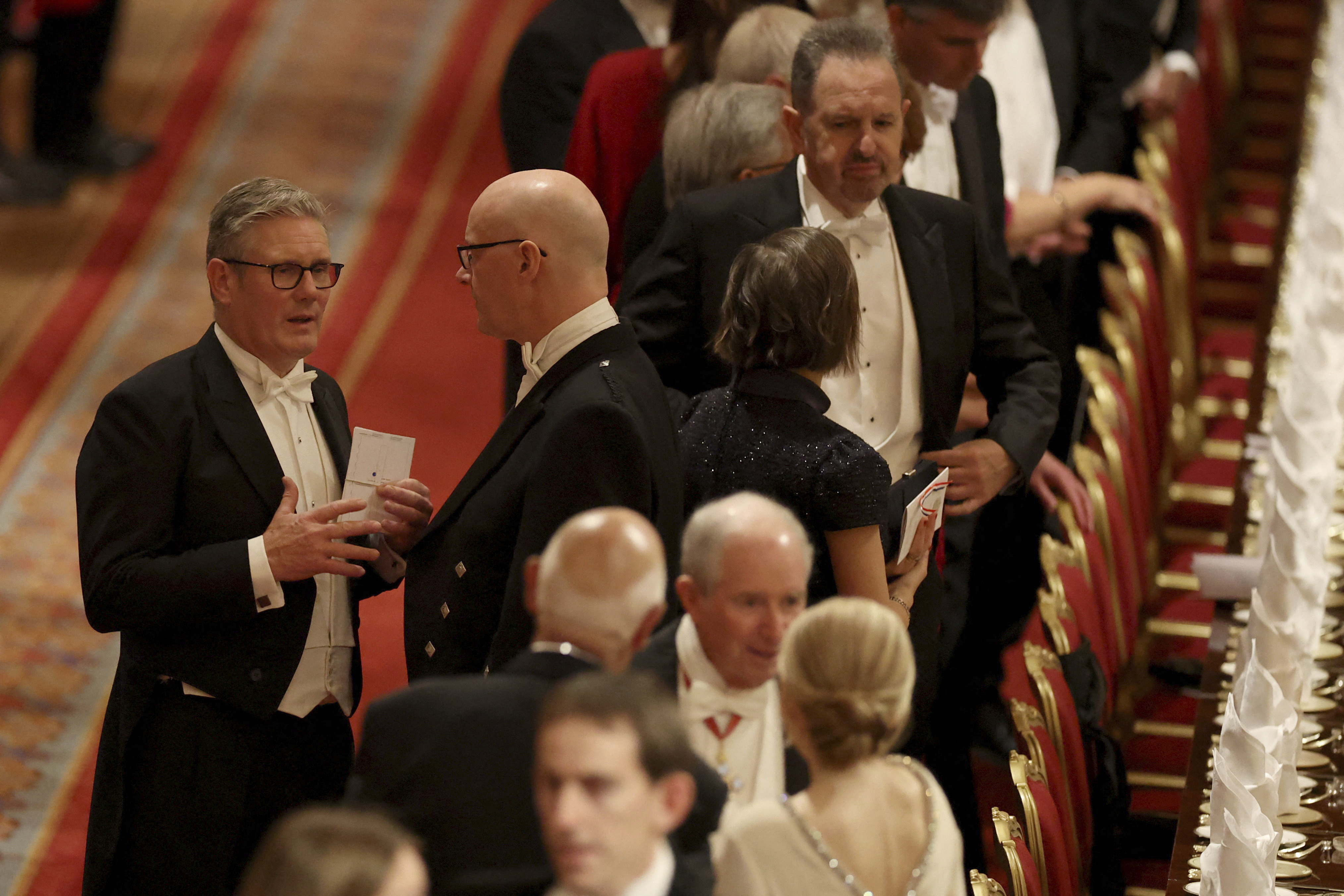 Britain's Prime Minister Keir Starmer, left, arrives for a State Banquet at Windsor Castle, in Windsor, England, Sept. 17, 2025. (Phil Noble - Pool Reuters)