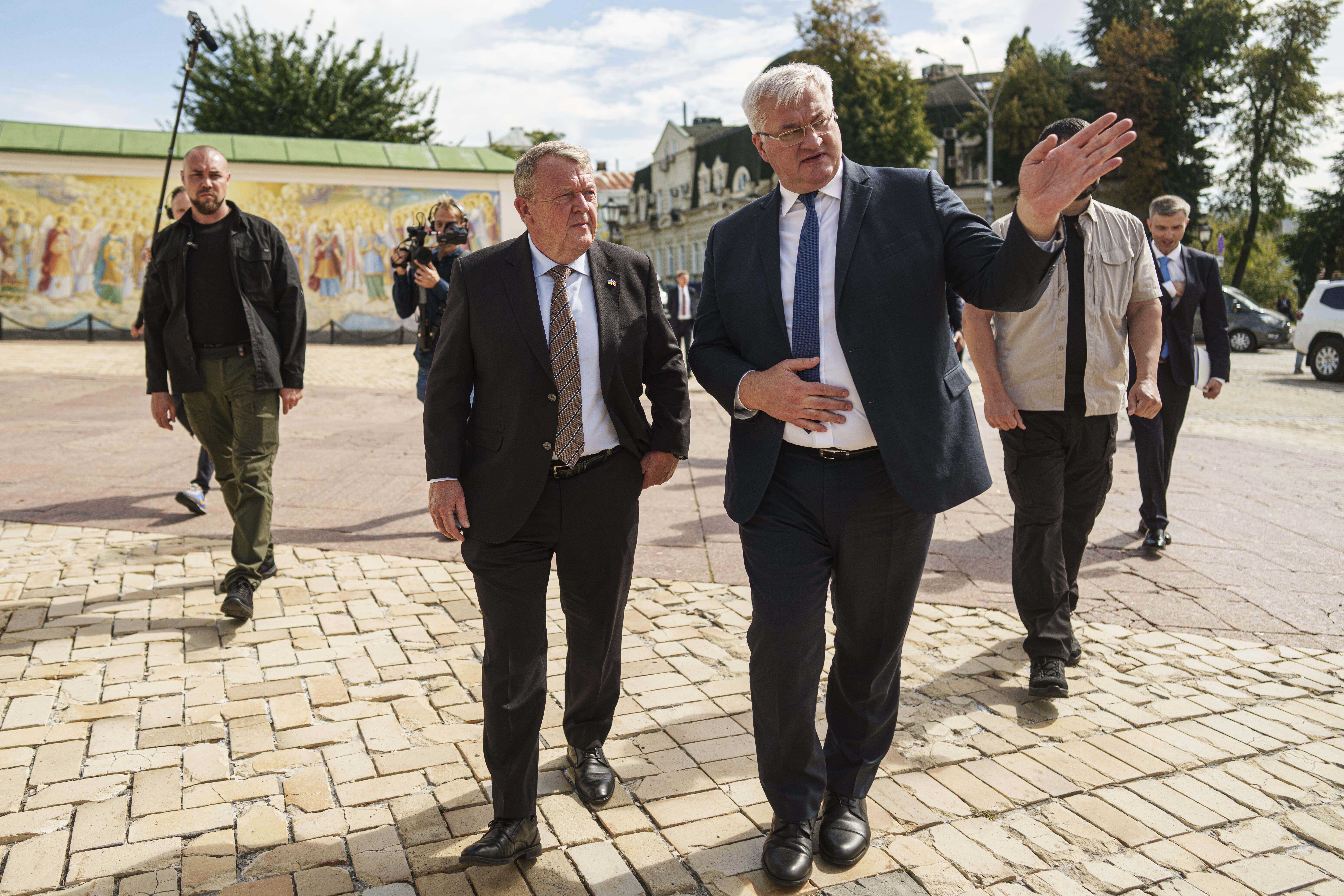 Denmark's Foreign Minister Lars Lokke Rasmussen, left, and Ukraine's Foreign Minister Andrii Sybiha, right, walk in center of Kyiv, Ukraine, on Friday, Sept. 12, 2025. (Evgeniy Maloletka - AP)
