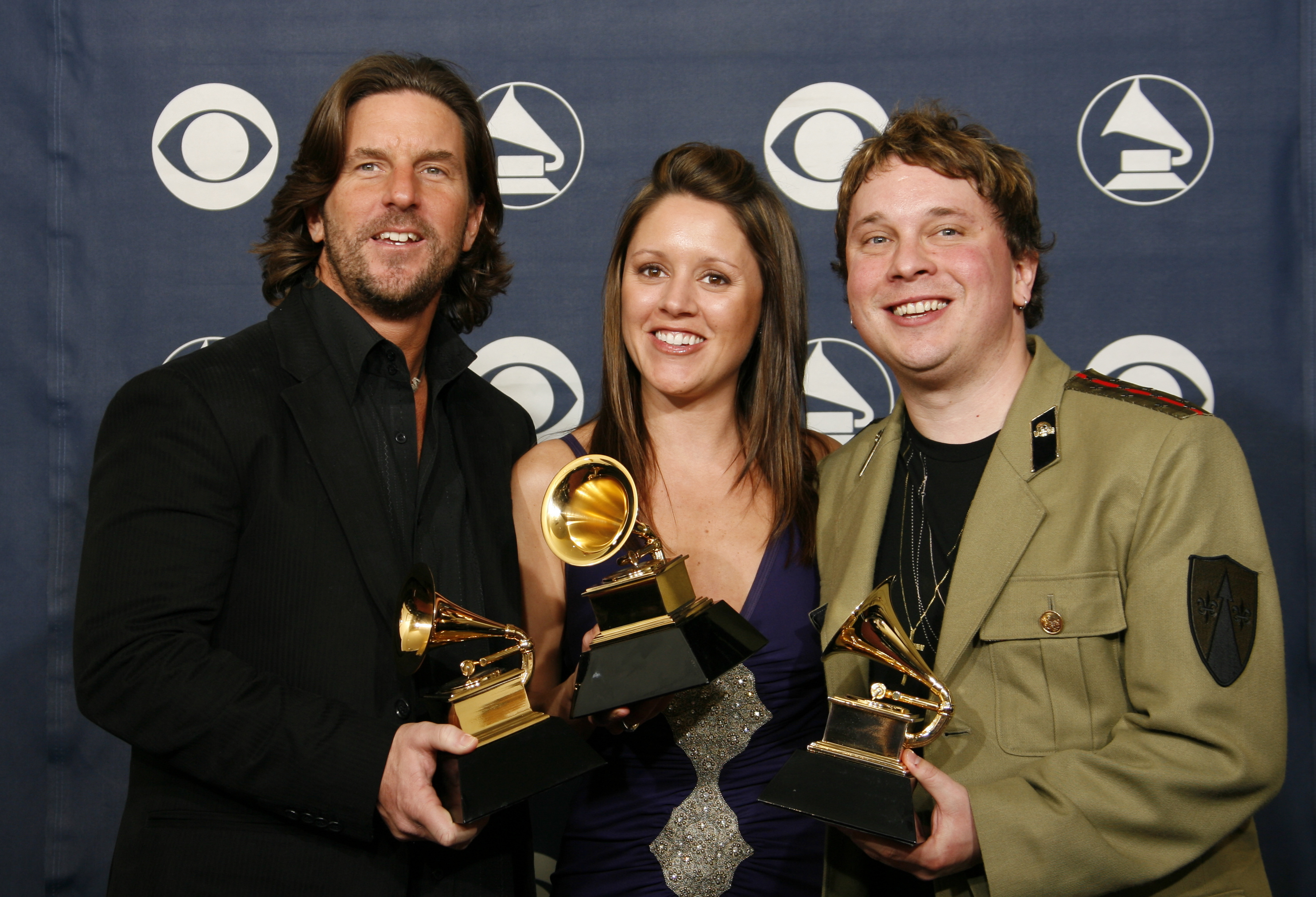FILE - Brett James, from left, Hillary Lindsey and Gordie Sampson hold their award for best country song,