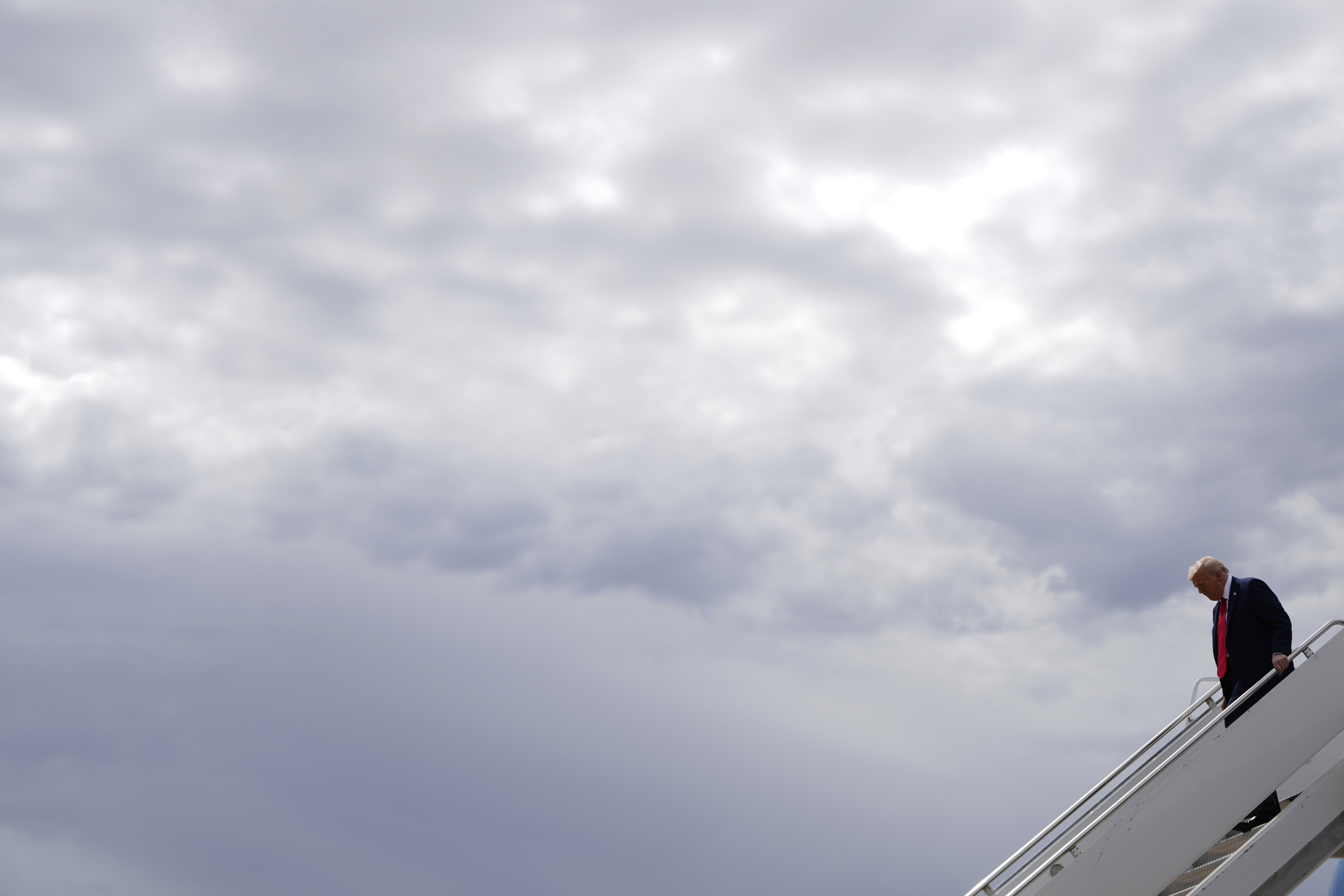 President Donald Trump disembarks Air Force One, Sunday, Sept. 21, 2025, upon arriving at Luke Air Force Base, Ariz., to attend a memorial for conservative activist Charlie Kirk. (Julia Demaree Nikhinson - AP)