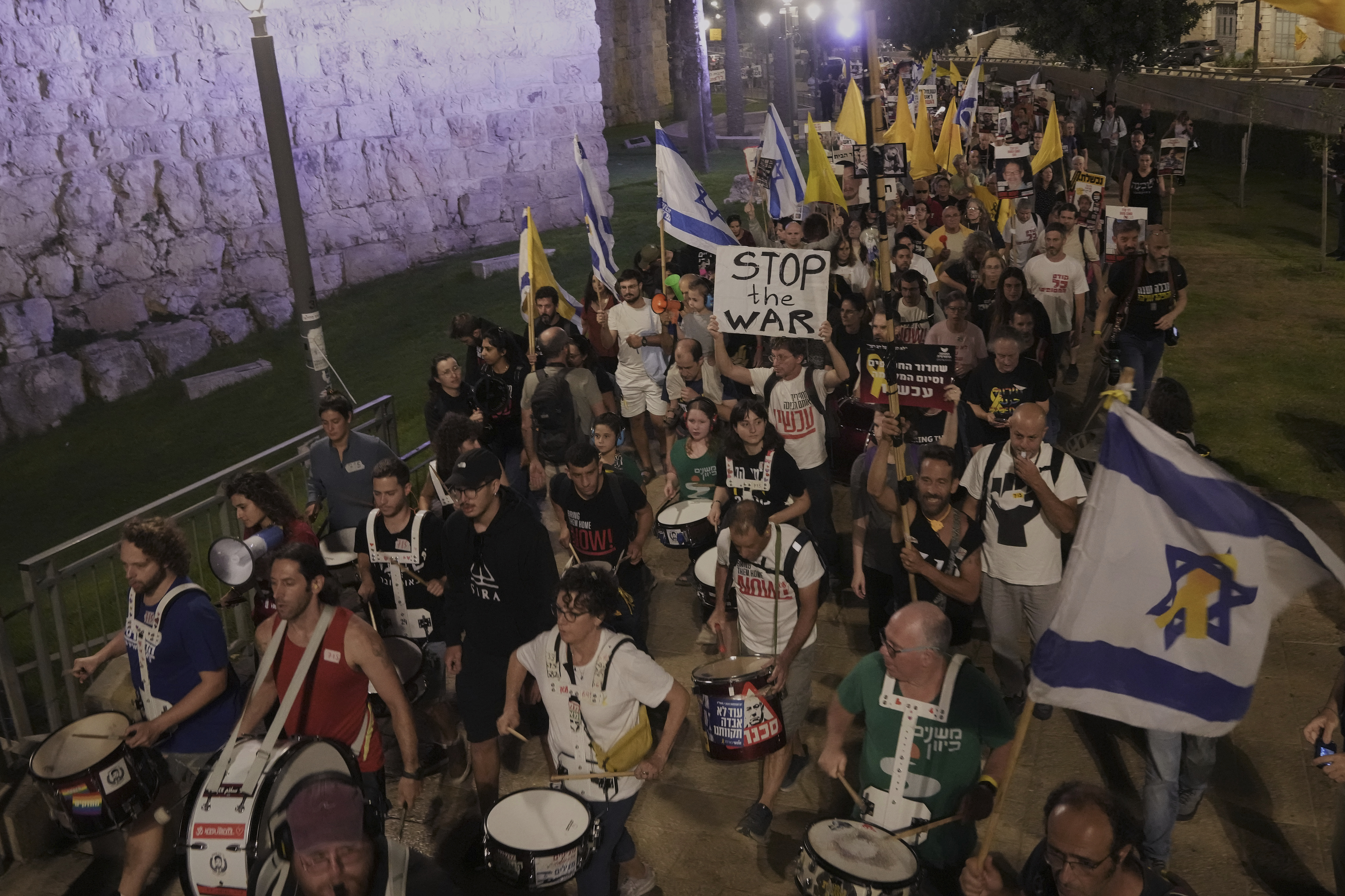 Relatives and supporters of Israeli hostages held in the Gaza Strip take part in a protest demanding their release from Hamas captivity and calling for an end to the war, outside the Old City of Jerusalem, Saturday, Sept. 20, 2025. (Mahmoud Illean - AP)